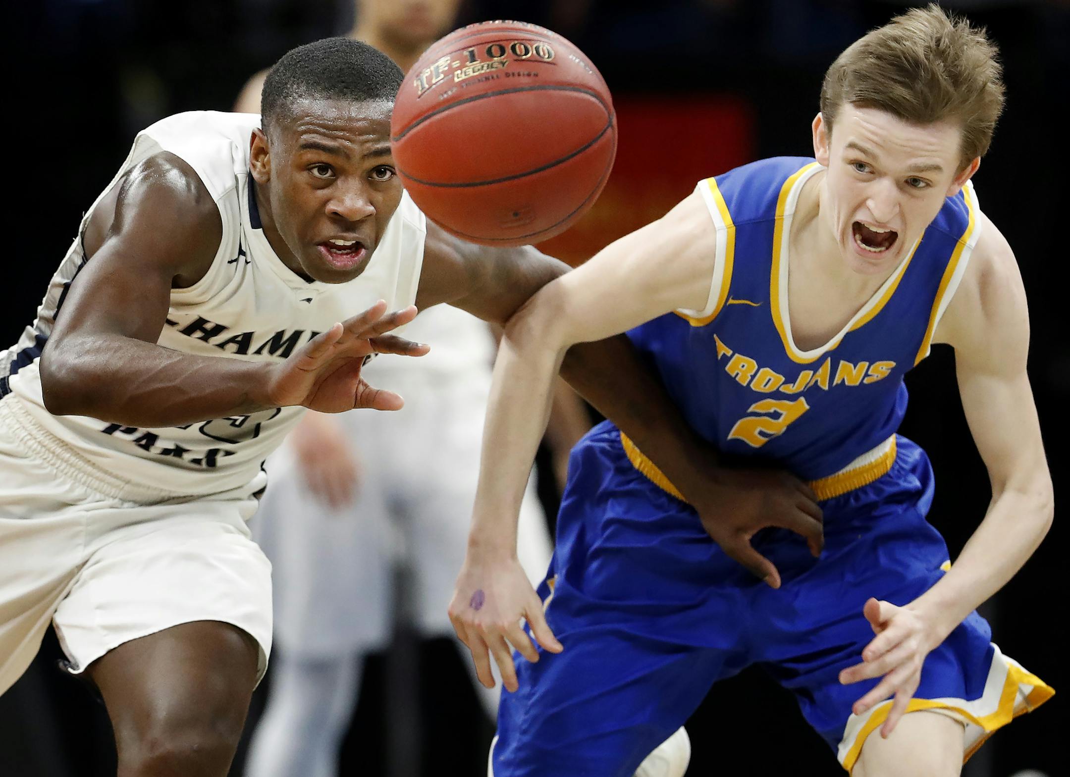McKinley Wright (25) of Champlin Park and Jacob Beeninga (2) of Wayzata chased a loose ball in the first half. ] CARLOS GONZALEZ ï cgonzalez@startribune.com - March 23, 2017, Minneapolis, MN, Target Center, Minnesota State High School League Boysí Basketball State Tournament, Quarterfinals, Class 4A semifinals, Champlin Park vs. Wayzata