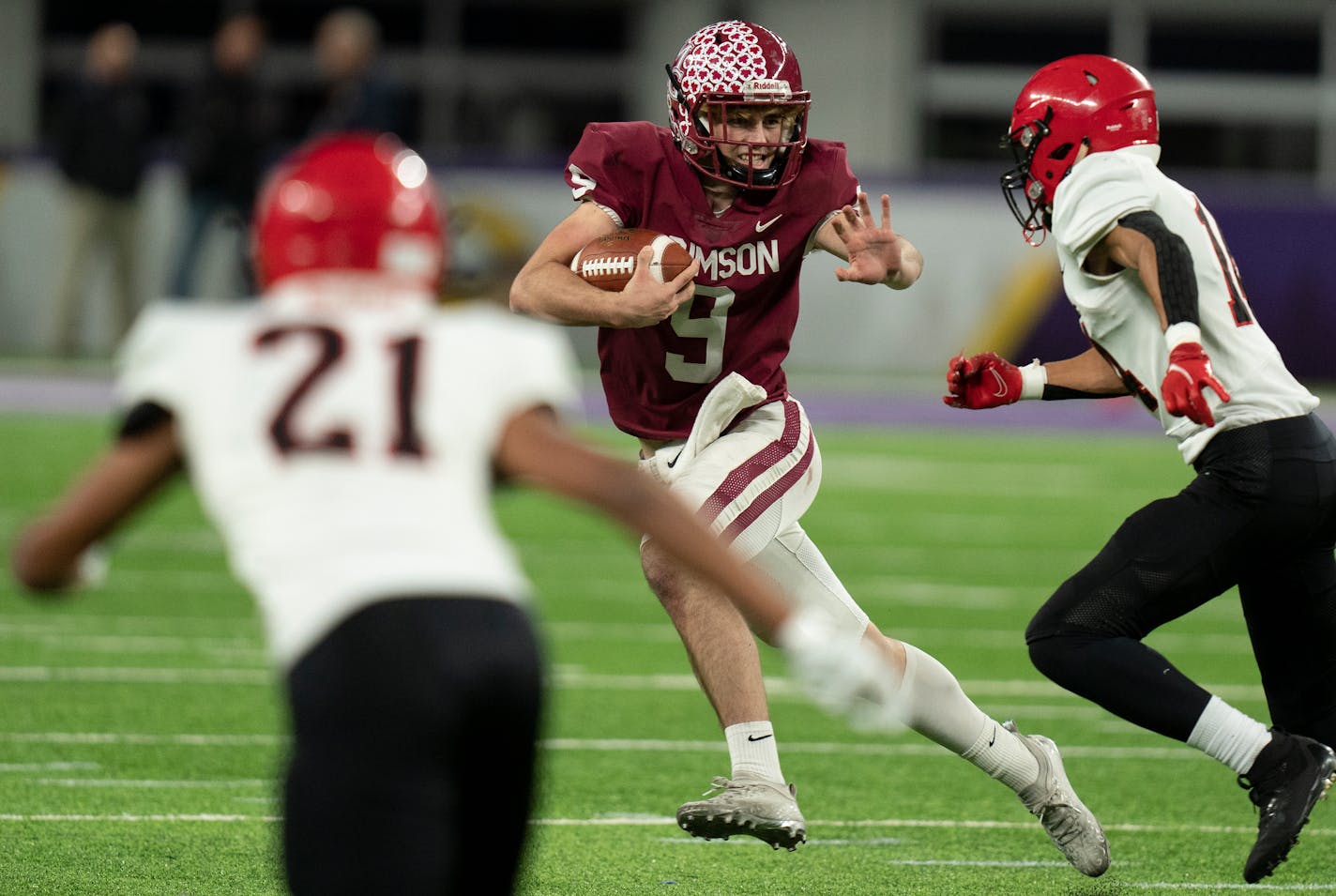 Maple Grove's Jacob Kilzer(9) tries to evade the Eden Prairie defense in Minneapolis, Minn., on Thursday, Nov. 18, 2021. In the Class 6A Semifinals for football Eden Prairie faces off against Maple Grove.] RICHARD TSONG-TAATARII • richard.tsong-taatarii@startribune.com