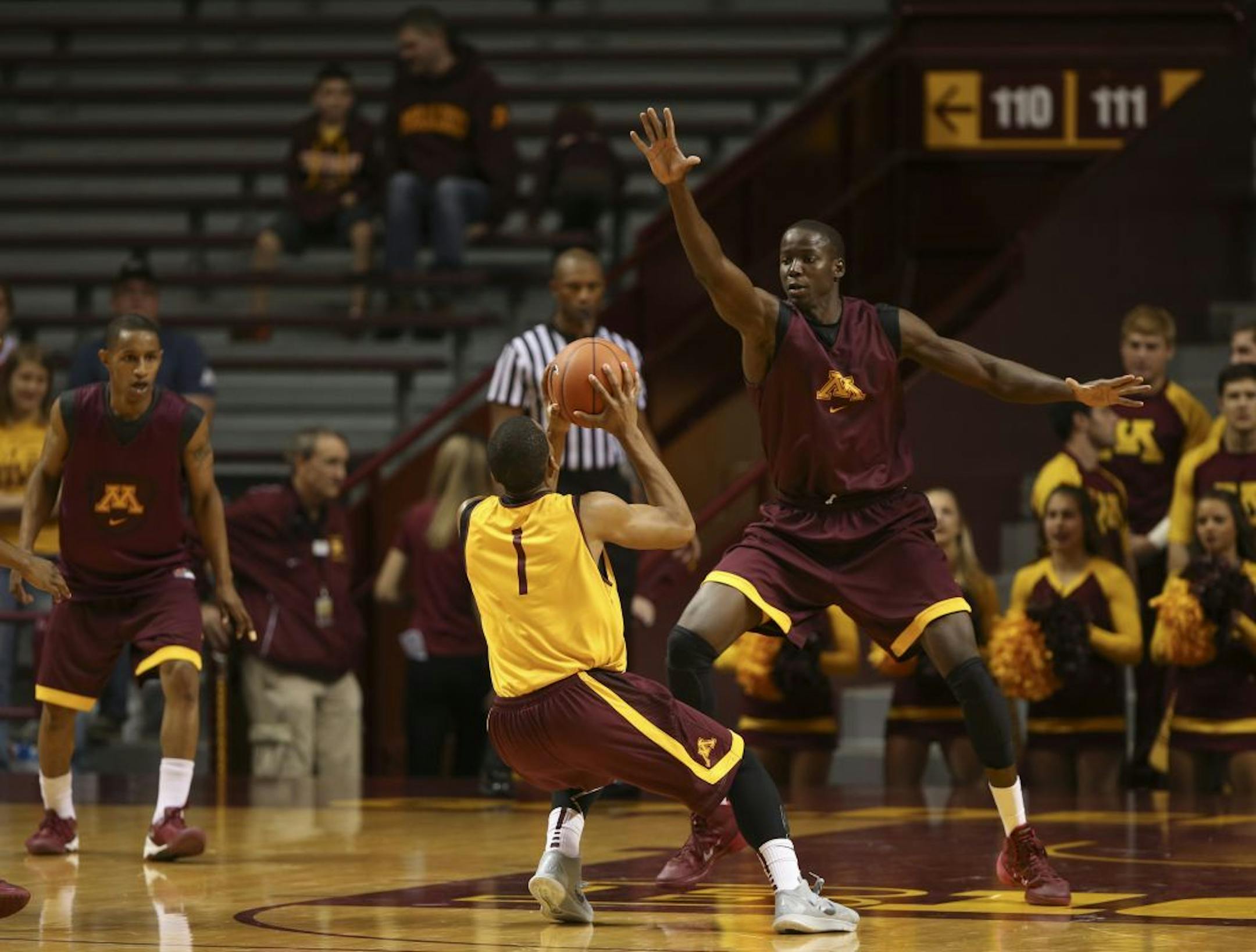 Maroon's Bakary Konate loomed large over Andre Hollins as he looked to shoot during the intrasquad game Sunday afternoon.