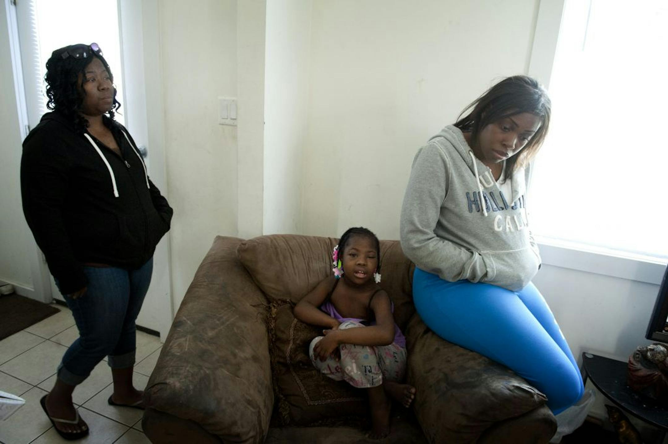From left, Pauviera Linson's aunt, Nancia Range, Range's daughter Gerleah Phillips and Pauviera's mother, Makiesha Johnson, at Range's St. Paul home.
