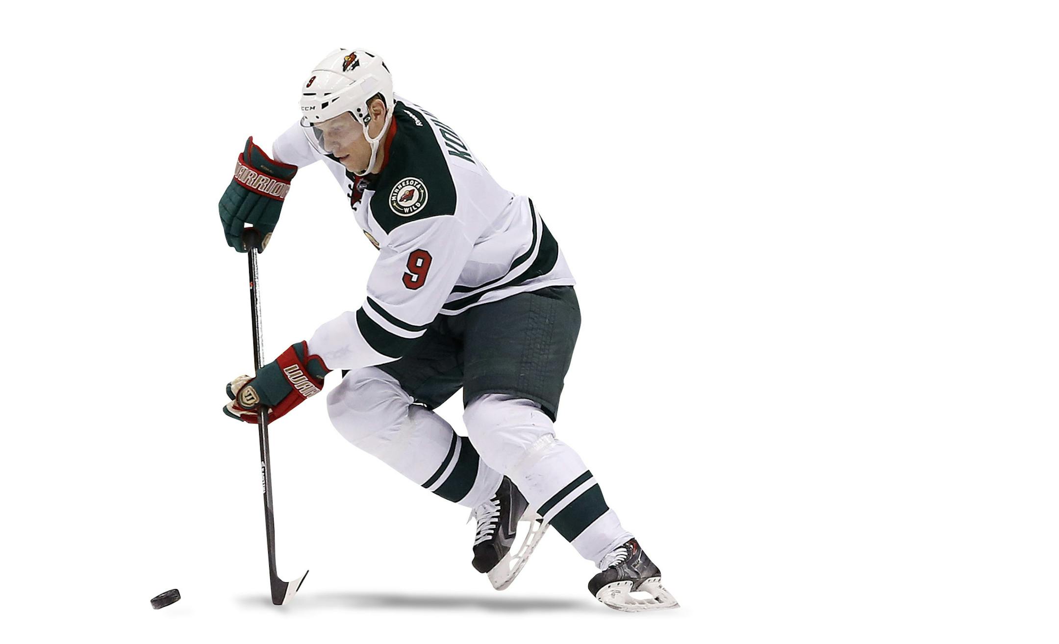 Minnesota Wild's Mikko Koivu (9), of Finland, skates with the puck as Phoenix Coyotes' Brandon McMillan (38) looks on during the first period of an NHL hockey game, Saturday, March 29, 2014, in Glendale, Ariz. The Wild defeated the Coyotes 3-1. (AP Photo/Ross D. Franklin) ORG XMIT: MIN2014041616444284