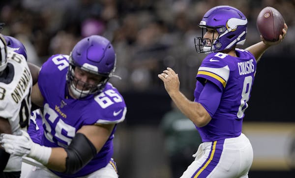Minnesota Vikings quarterback Kirk Cousins attempted a pass in the first quarter.