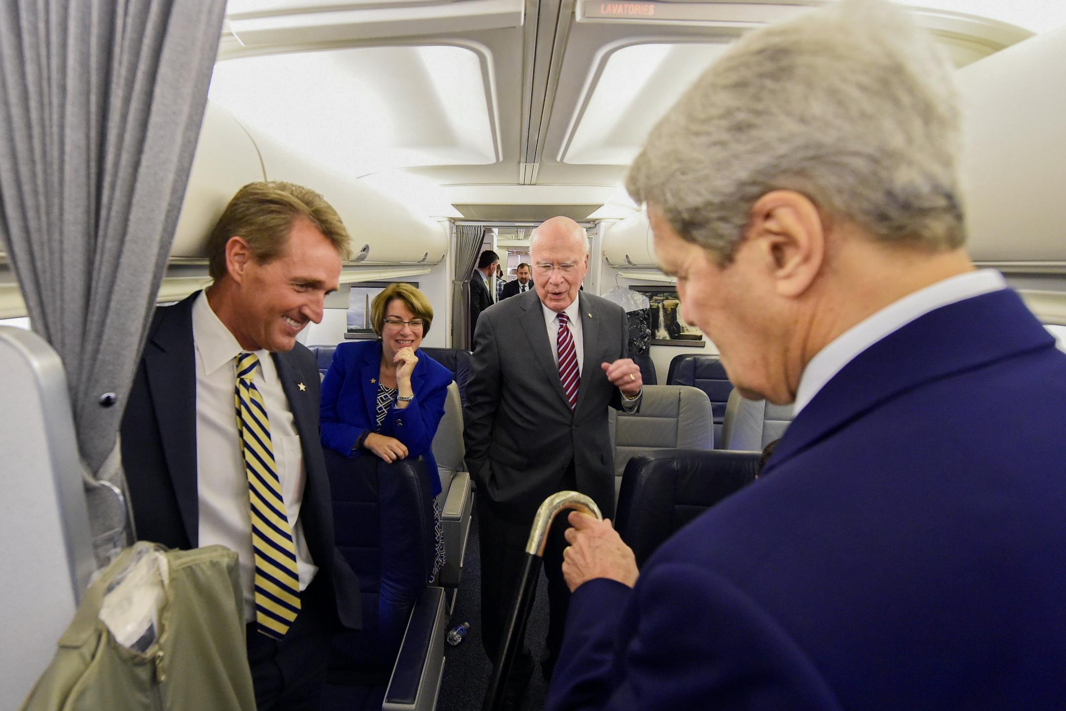 Sen.Amy Klobuchar on the State Department plane headed to Cuba with, from left, Sen. Jeff Flake of Arizon, Sen. Patrick Leahy of Vermont and Secretary of State John Kerry.