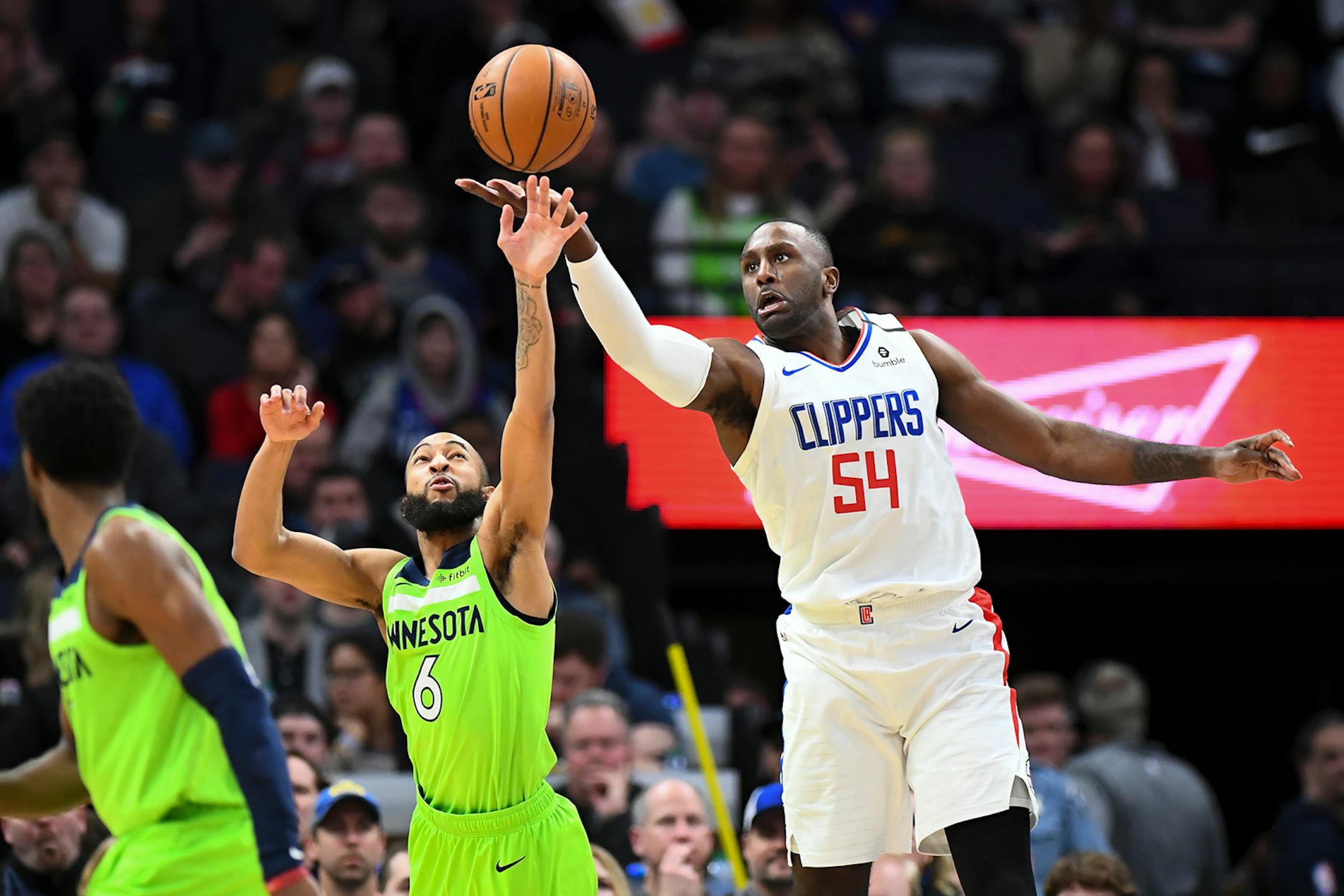 Minnesota Timberwolves guard Jordan McLaughlin (6) and LA Clippers forward Patrick Patterson (54) battled for a loose ball in the first half.
