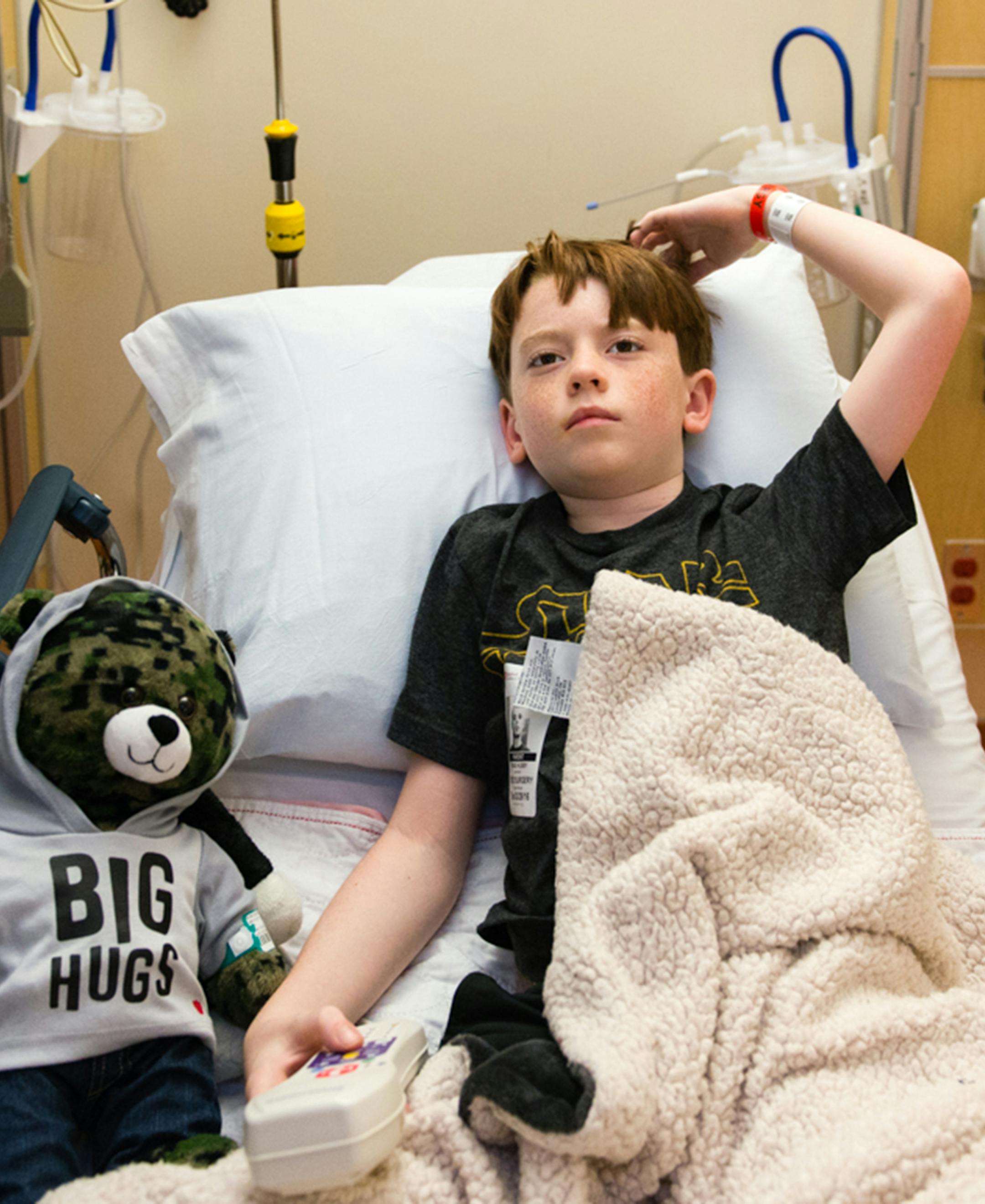 Matthew Husby, 9, watches a video on the Bedside Entertainment and Relaxation Theater, or BERT, before his surgery at Lucile Packard Children's Hospital in San Francisco on March 29, 2016. (Heidi de Marco/Kaiser Health News/TNS)