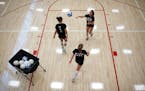 Lakeville North volleyball players practiced serving Monday, August 15, 2011.