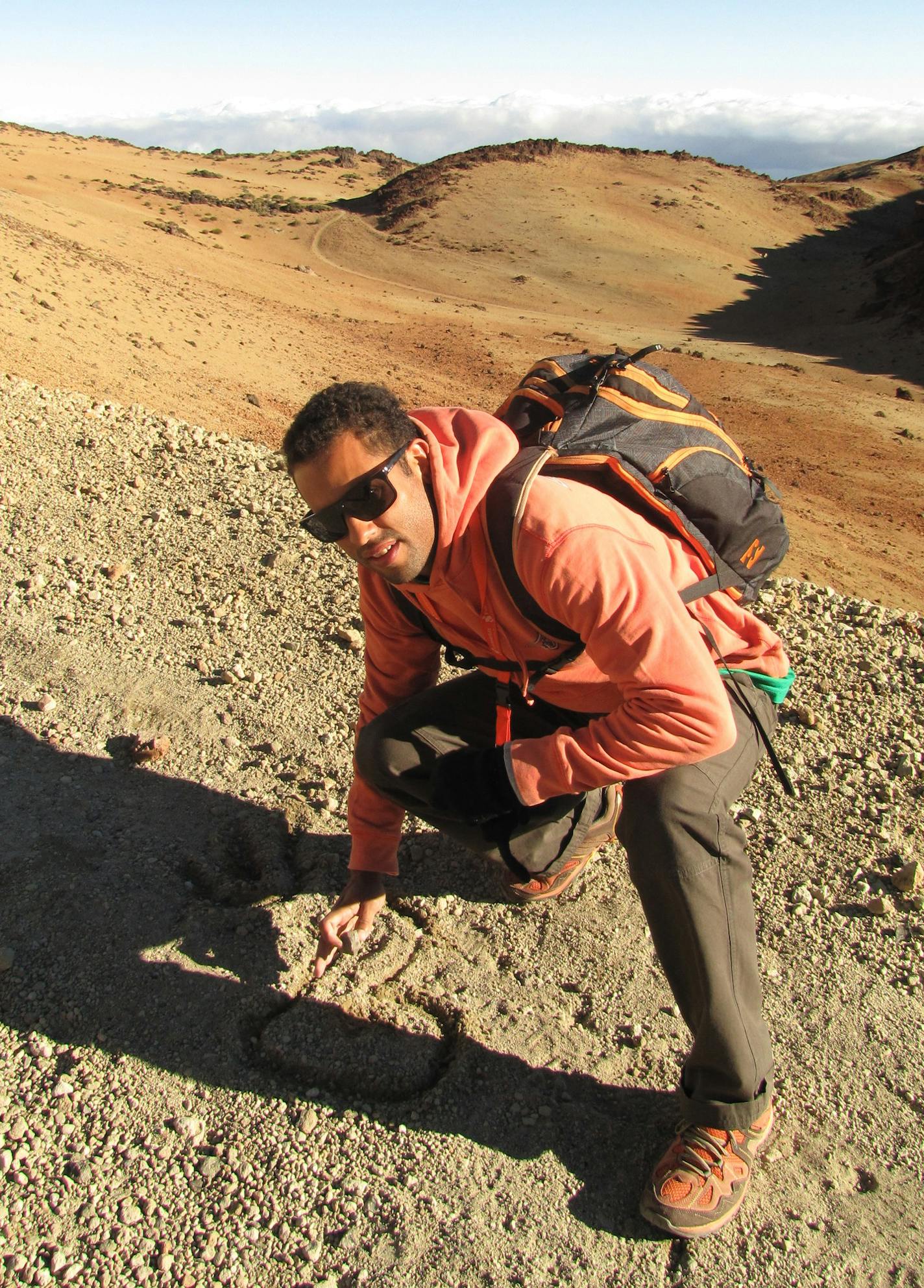 Guide Pedro Adan marks the dirt during a hike up Mt. Teide, in Spain's Teide National Park on the Canary Islands. ] Photo by Melanie Radzicki McManus/Special to the Star Tribune