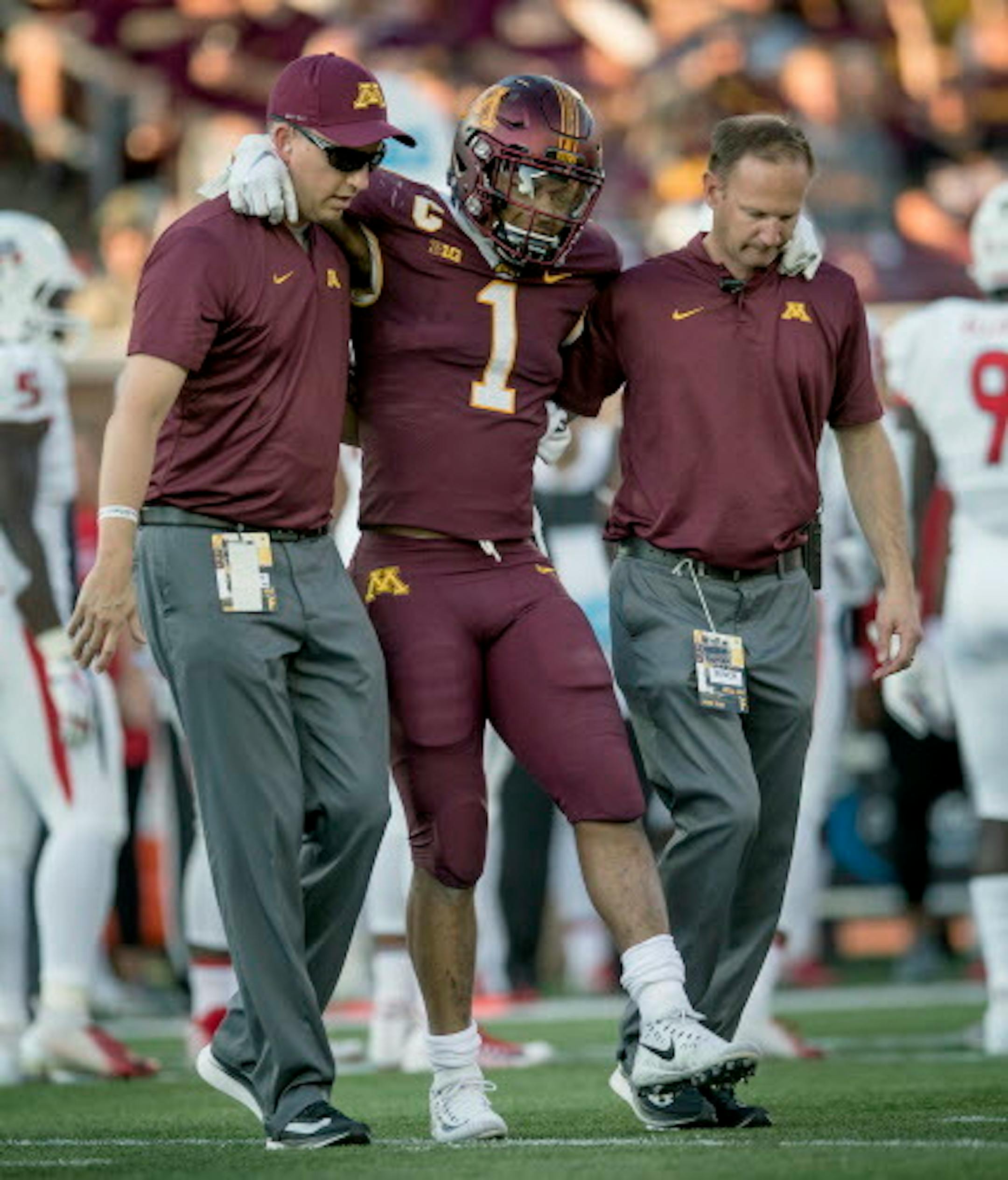 Minnesota's running back Rodney Smith is helped off the field after a first quarter injury as Minnesota took on Fresno State at TCF Bank Stadium, Saturday, September 8, 2018 in Minneapolis, MN.    ]  ELIZABETH FLORES ' liz.flores@startribune.com