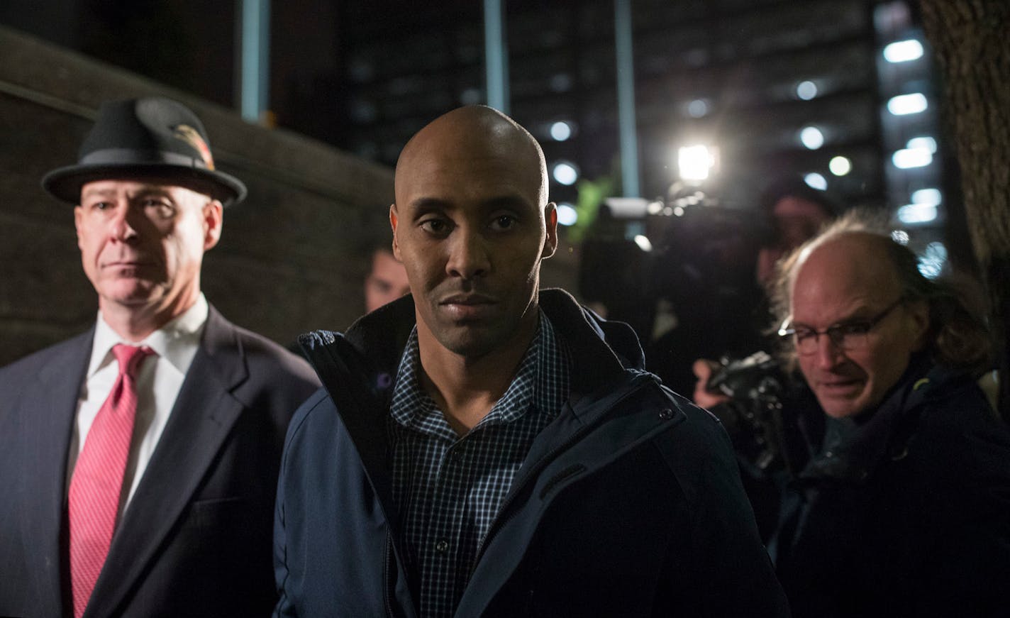 Former Minneapolis Police Officer Mohamed Noor left the Hennepin County Public Safety Facility with his attorney, Thomas Plunkett, after posting bail Wednesday night. ] JEFF WHEELER � jeff.wheeler@startribune.com Former Minneapolis Police Officer Mohamed Noor left the Hennepin County Public Safety Facility with his attorney, Thomas Plunkett, after posting bail Wednesday night, March 21, 2018.