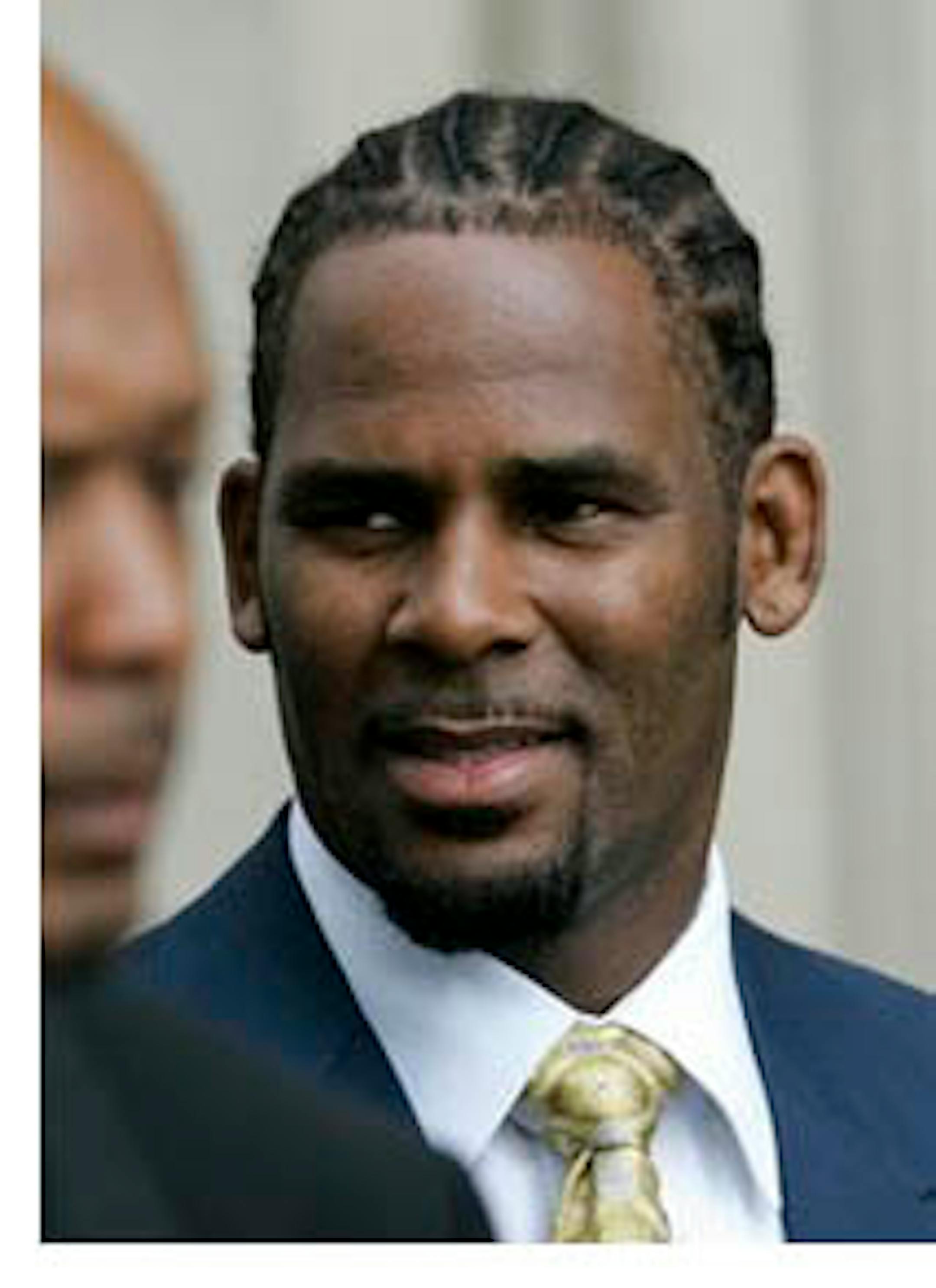 FILE - In this June 13, 2008 file photo, R&B singer R. Kelly leaves the Cook County Criminal Court Building in Chicago. Kelly faces a $2.9 million foreclosure on his suburban Chicago mansion. Chicago Real Estate Daily reports Tuesday, July 12, 2011, that JPMorgan Chase Bank filed the foreclosure lawsuit last month in Cook County Circuit Court. The complaint states that Kelly hasn't made monthly mortgage payments since June of last year.(AP Photo/M. Spencer Green, File)