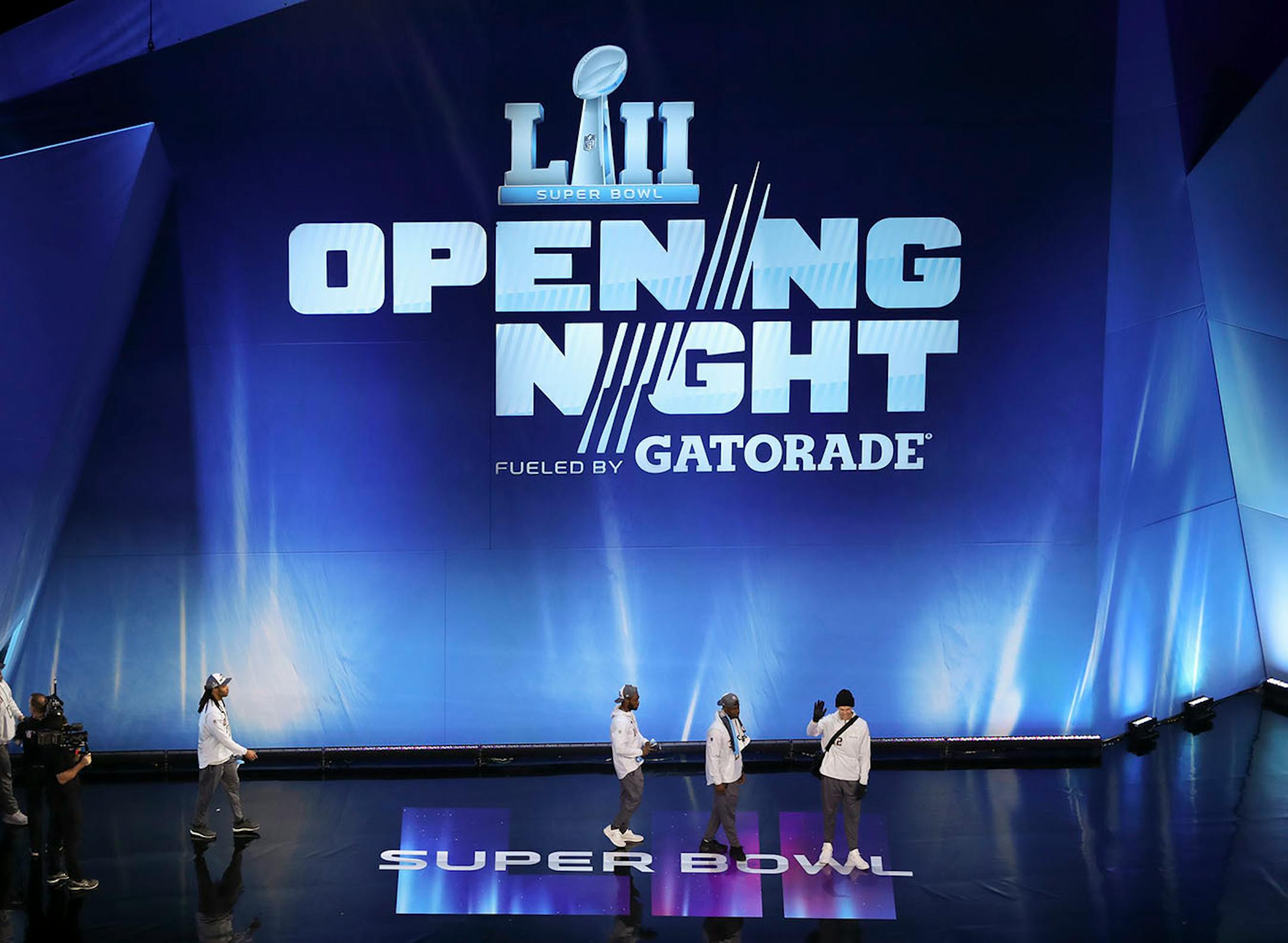 Patriots quarterback waved after he led the team onto the stage for the start of the Opening Night program.