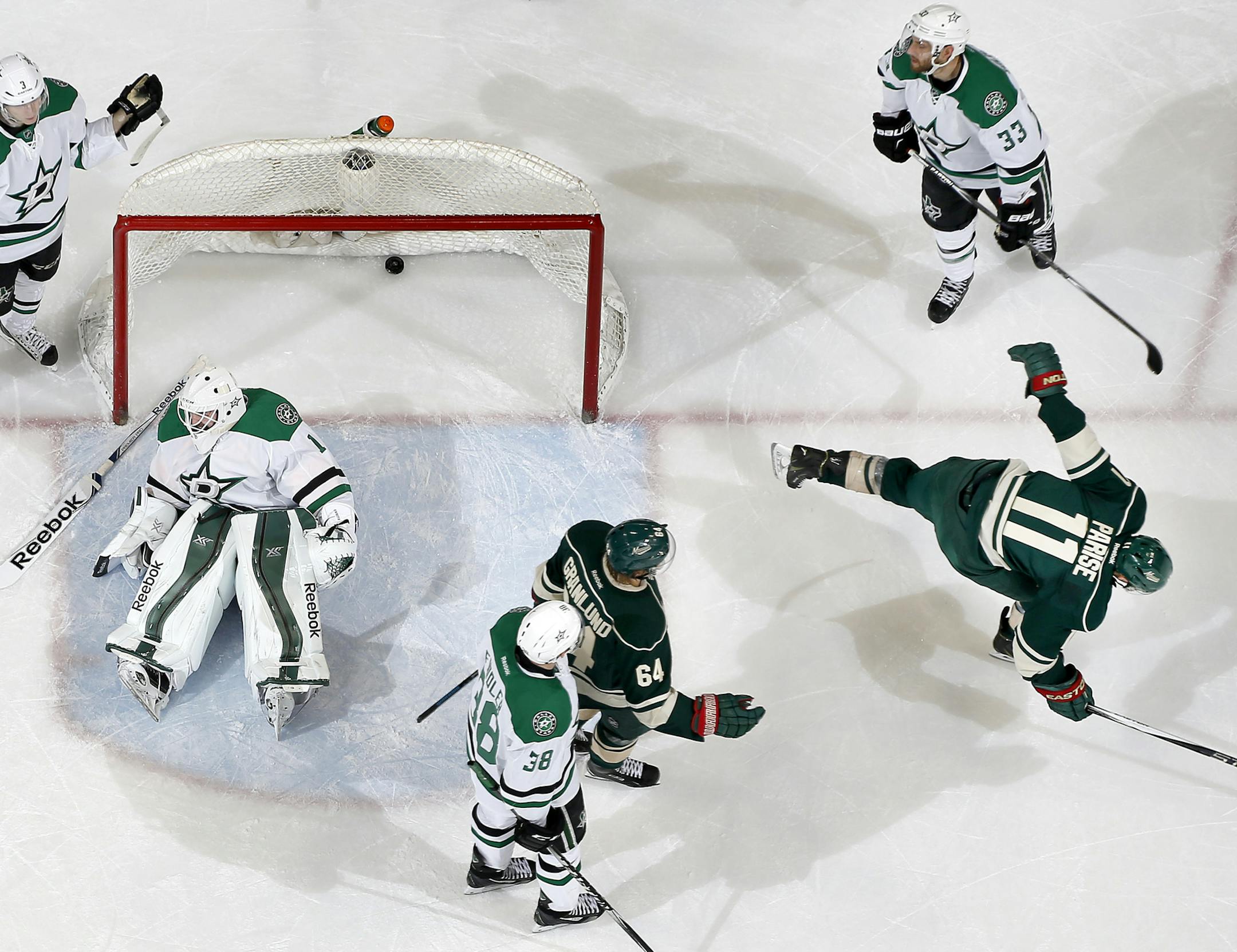 Zach Parise (11) celebrated after shooting the puck past Dallas Stars goalie Jhonas Enroth (1) for his second goal in the third period. ] CARLOS GONZALEZ cgonzalez@startribune.com, February 22, 2015, St. Paul, Minn., Xcel Energy Center, NHL, Minnesota Wild vs. Dallas Stars