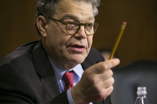 Sen. Al Franken (D-Minn.) questions former Texas Gov. Rick Perry during his confirmation hearing for secretary of energy.