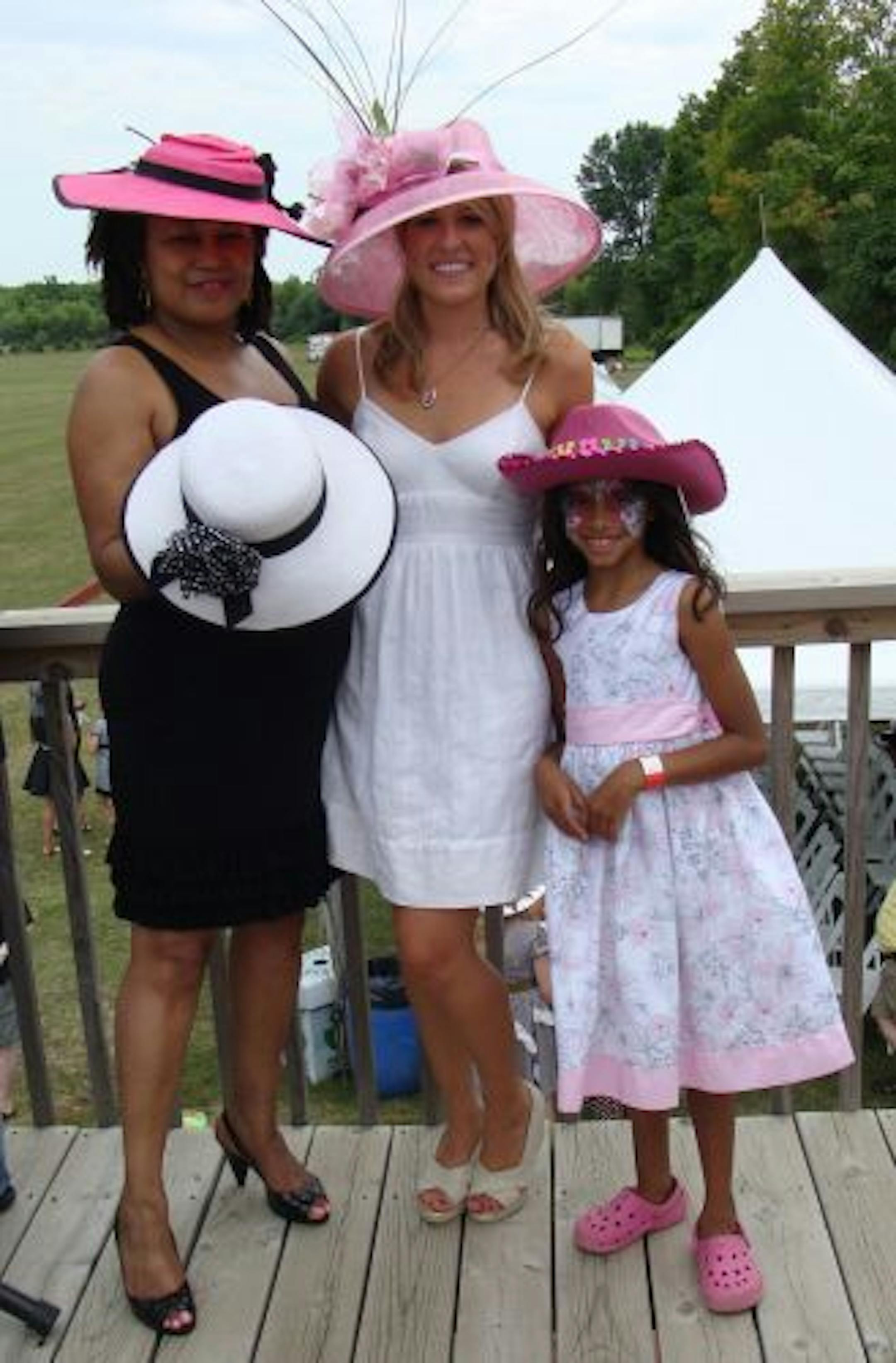 Sara Glassman, sglassman@startribune.com 20th Annual Twin Cities Polo Classic in Indepence, MN, benefitting Children's Cancer Research Fund. Designer Angie Hall Sandifer of Angie�s hats with hat contest winners Kelli Wirth and Amani Stivland, age 7.
