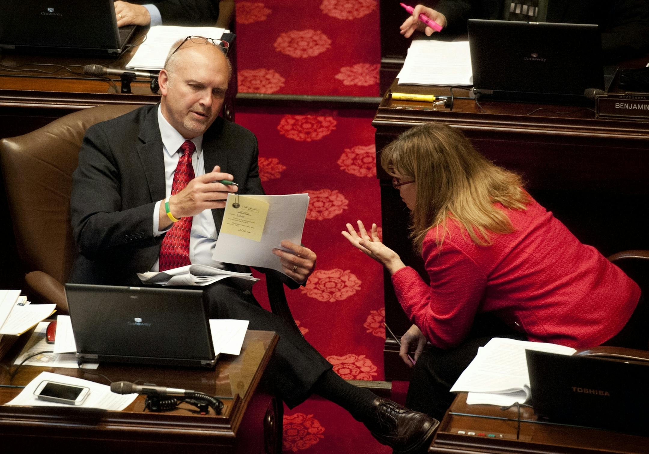 Stadium opponents Sen. Roger Chamberlain, R-Lino Lakes and Sen. Pam Wolf, R-Spring Lake Park pored over an amendment to the stadium bill during floor debate of the bill. Tuesday, May 8, 2012.