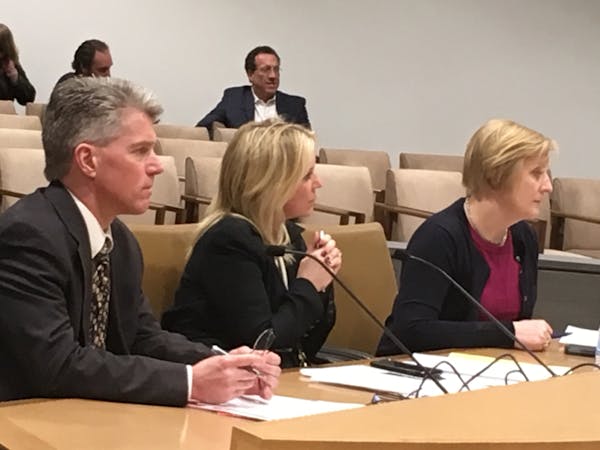 Minnesota state Sen. Karin Housley (center) is flanked by senior care lobbyists Toby Pearson (left), with Care Providers of Minnesota, and Kari Thurlo