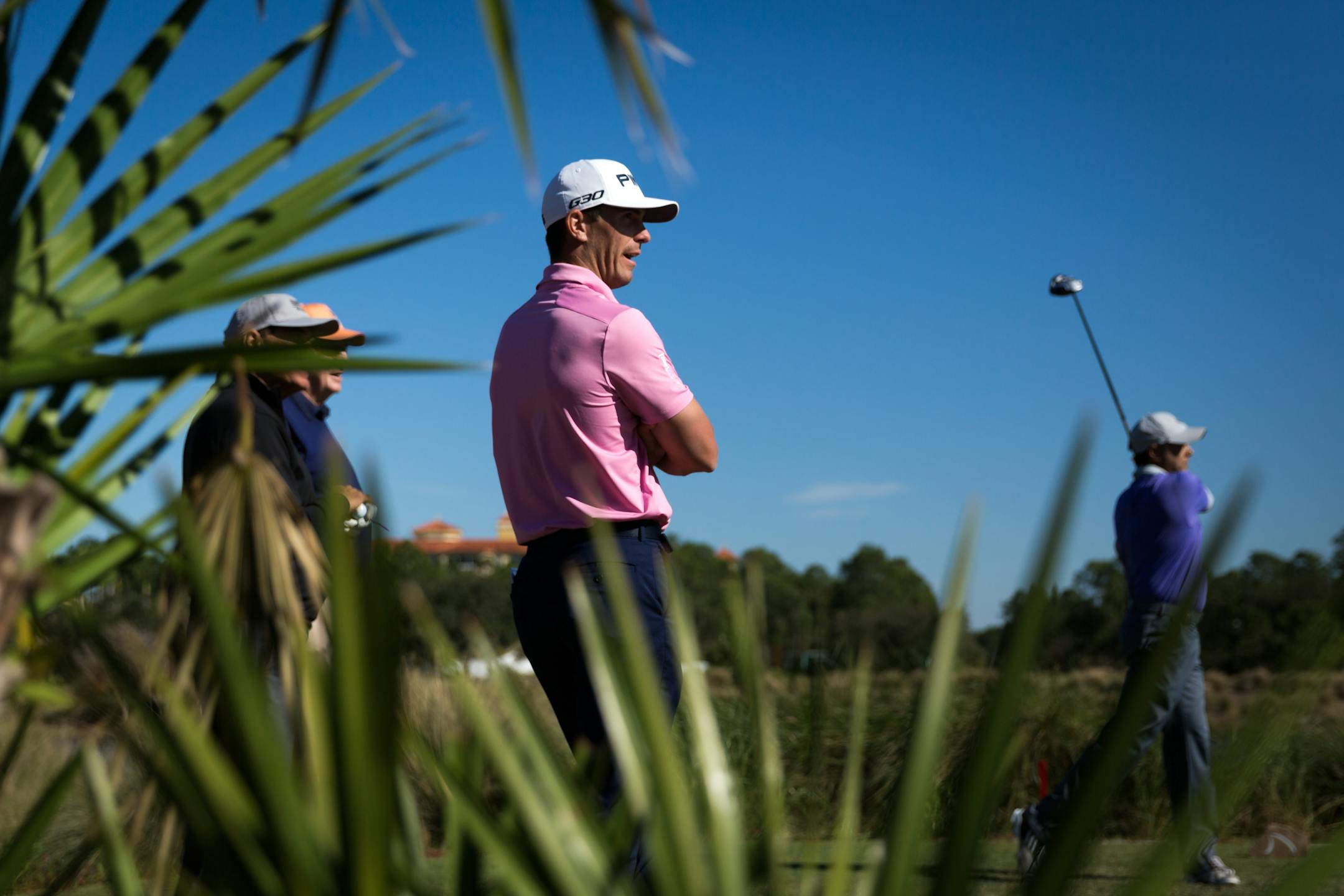 The 2014 FedEx Cup champion Billy Horschel, center, watches his playing partners tee off at the 18th hole while playing in the second day of the Franklin Templeton Shootout Pro-Am on Wednesday, Dec. 10, 2014, at the Tiburon Golf Club in Naples, Fla. (AP Photo/Naples Daily News, David Albers) FORT MYERS OUT