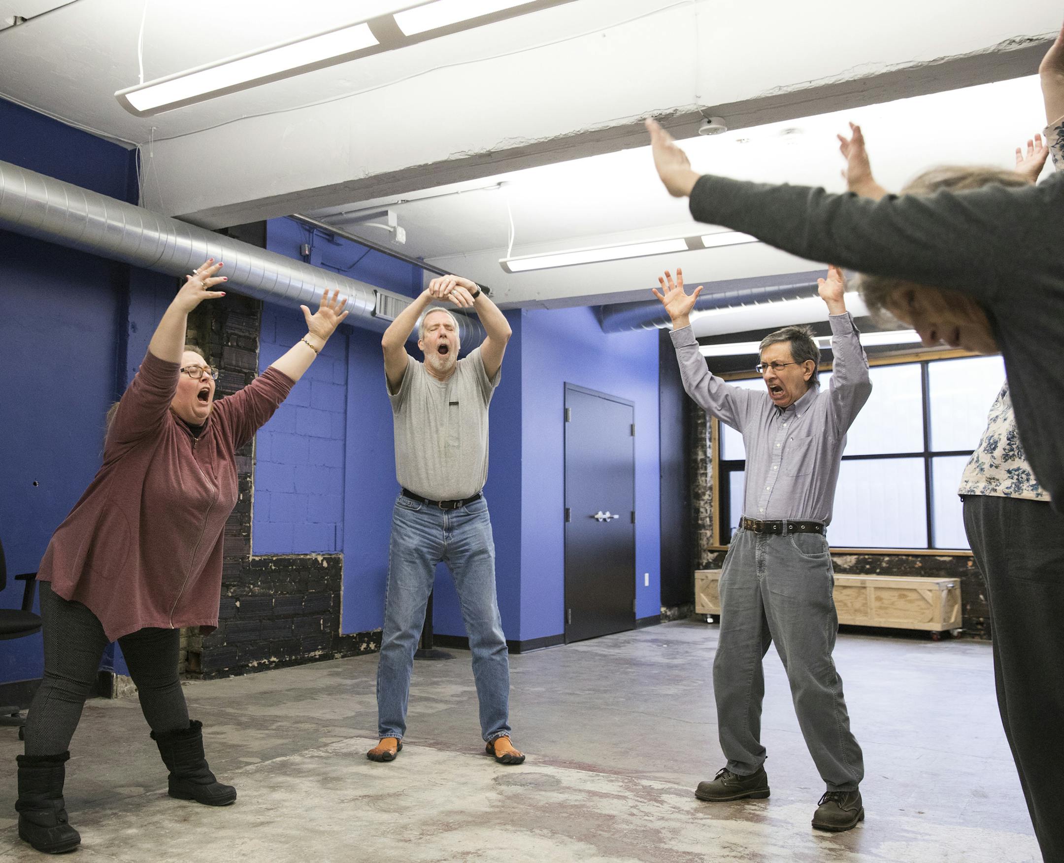 Improv instructor Lauren Anderson, from left, leads the class in movement warmups with students Jim Beggs, 71, and Scott Schumack, 66. ] LEILA NAVIDI • leila.navidi@startribune.com BACKGROUND INFORMATION: The Advanced 55+ Improv Class at Brave New Workshop Student Union meets for a class in downtown Minneapolis on Monday, January 30, 3017.