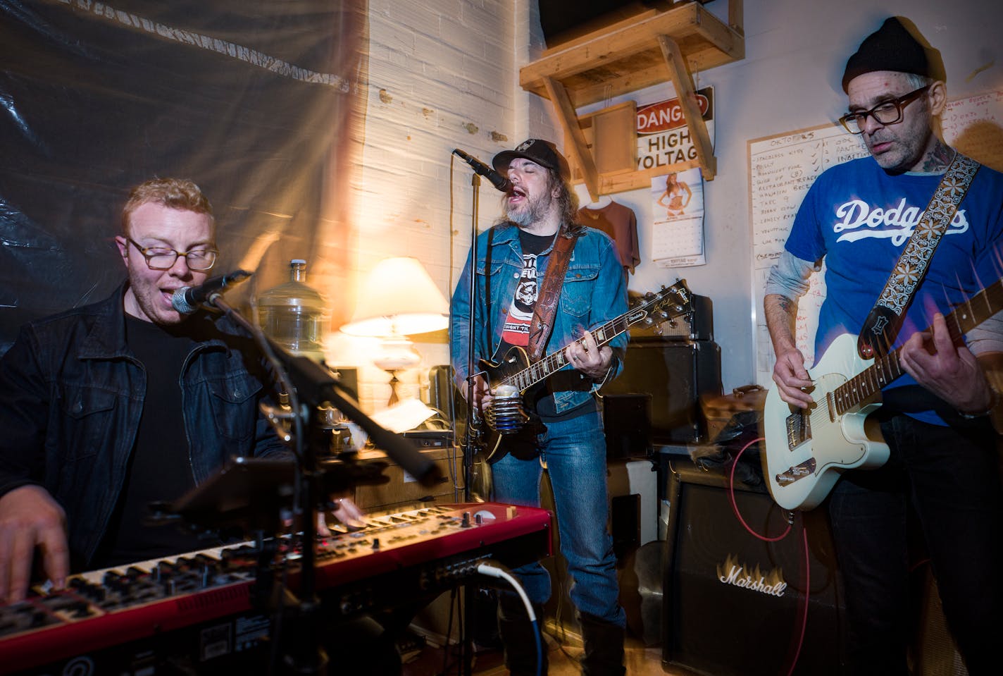 Keyboardist Charlie Smith, lead singer Brian Vanderwerf, and guitarist Jeff Johnson, members of Eleganza rehearse in their practice studio in Minneapolis, Minn., on Thursday, April 21, 2022. The grimy, Stones-meets-Stooges sextet has a new record coming April 29 produced by a member of the Drive-by Truckers, titled "Water Valley High." The band also features Romantica bassist Tony Zaccardi (owner of Palmer's Bar) and other longtime local rock vets.] RICHARD TSONG-TAATARII • richard.tsong-taatarii@startribune.com