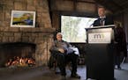 Vice President Walter Mondale sat in chair by a fireplace in a shelter as Rep. Ryan Winkler spoke about him at a dedication for part of William O'Brie