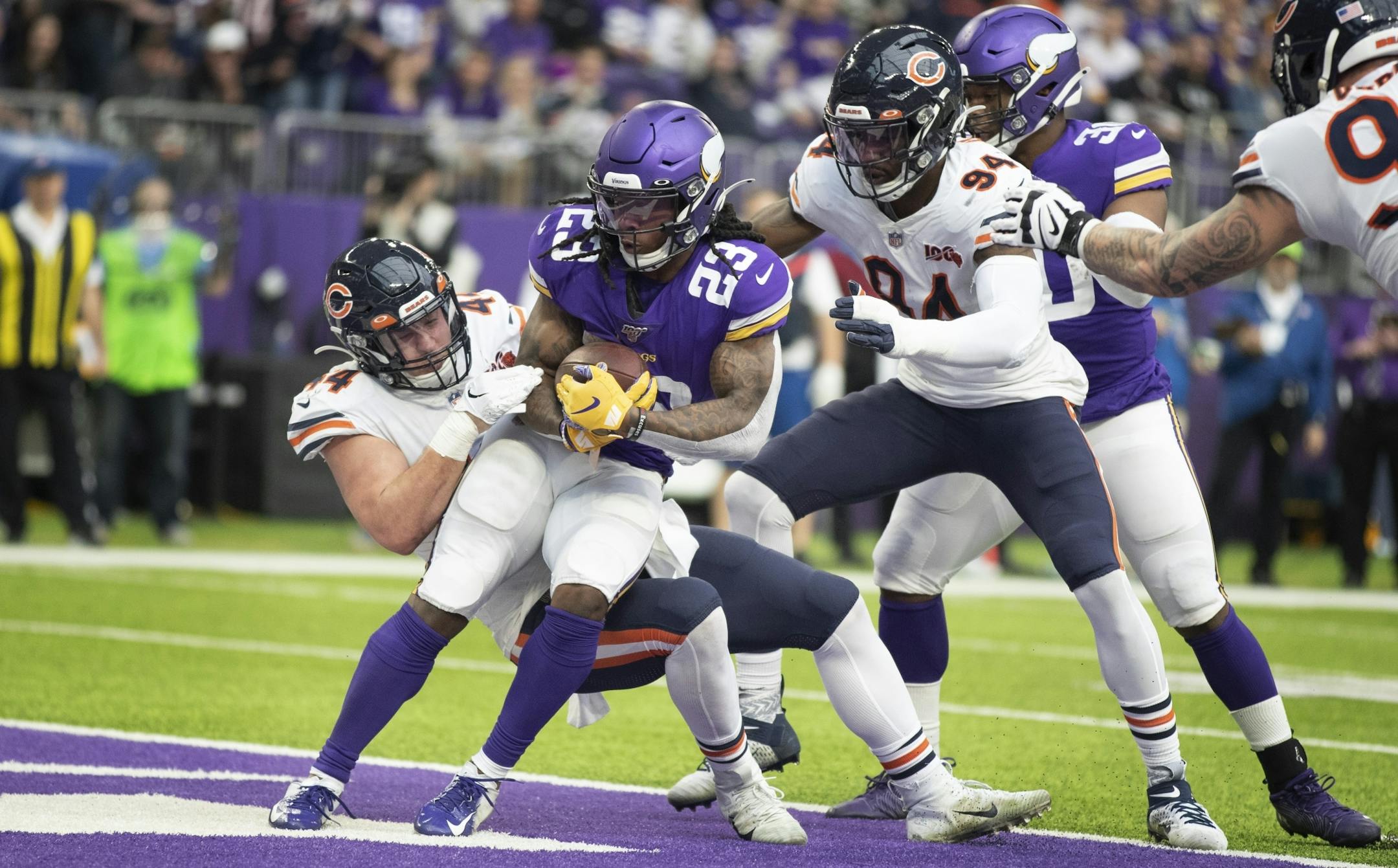 Minnesota Vikings running back Mike Boone (23) was tackled in the end zone for a safety by Chicago Bears inside linebacker Nick Kwiatkoski (44) in the second quarter.