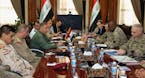 U.S. Army Gen. Lloyd Austin, commander of the U.S. Central Command, second right, meets with Iraq's Defense Minister Khaled al-Obeidi, third left, in 