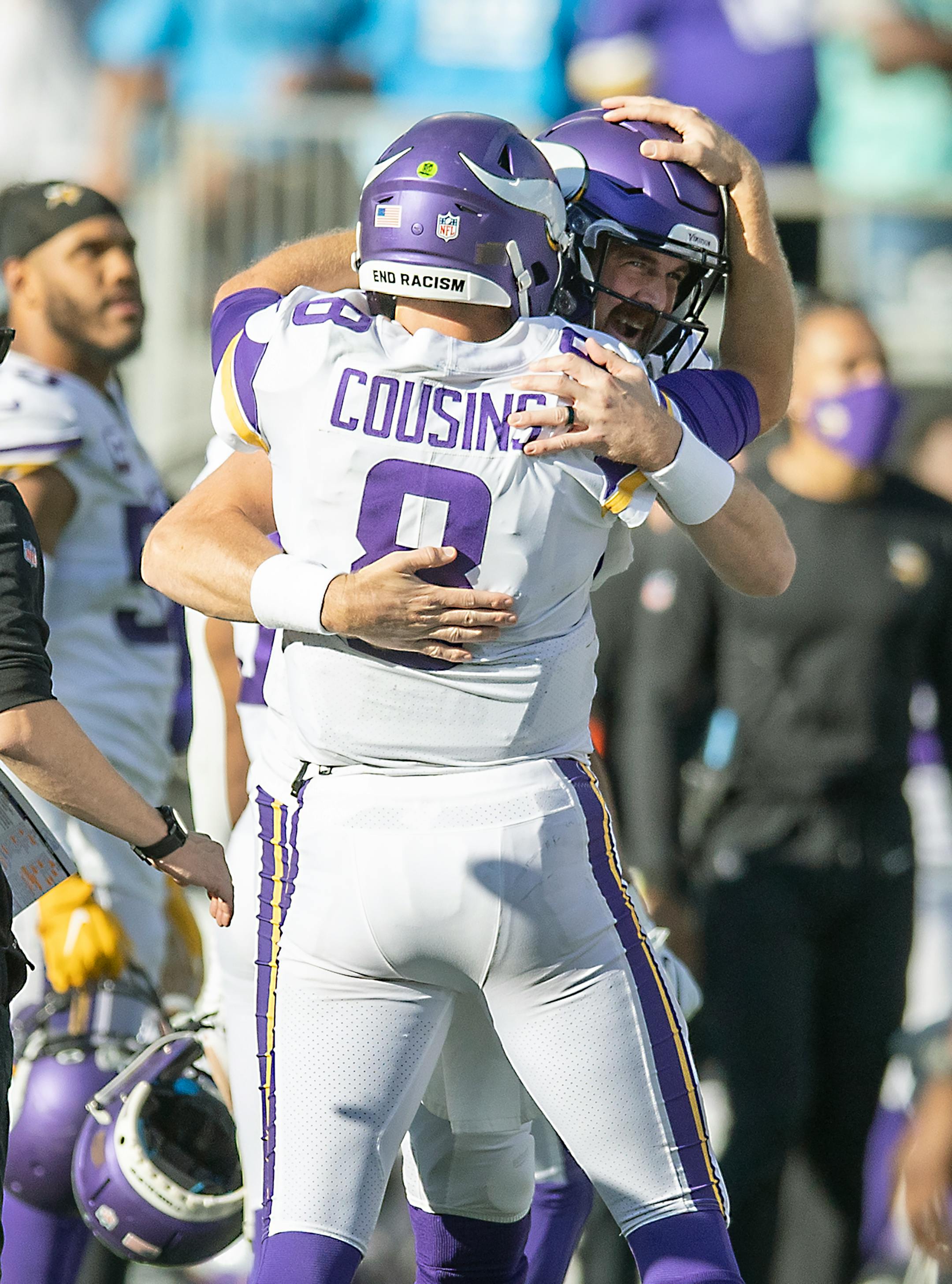 Vikings quarterback Kirk Cousins (8) celebrated with Vikings quarterback Nate Stanley (14) after his pass to Vikings wide receiver K.J. Osborn.