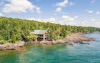 This log home is built on ledge rock on the shore of Lake Superior.