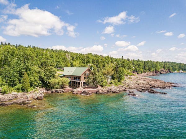 This log home is built on ledge rock on the shore of Lake Superior.