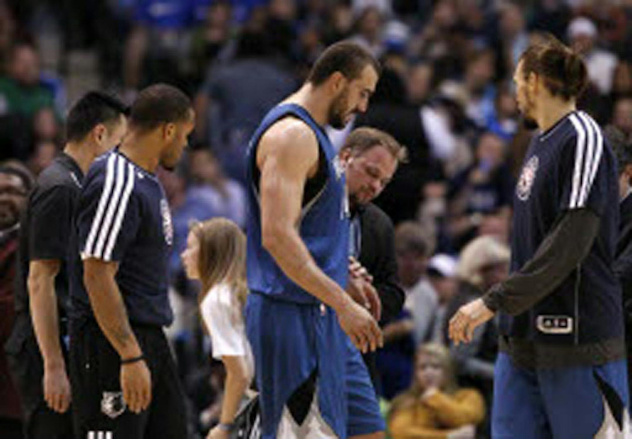 Wolves center Nikola Pekovic was helped off the floor in the third quarter after he turned his ankle against Dallas on Monday. He didn't return to the game.