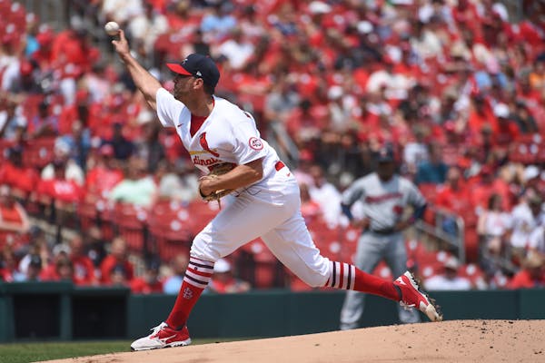St. Louis Cardinals starting pitcher Adam Wainwright throws during the first inning of a baseball game against the Minnesota Twins on Sunday, Aug. 1, 