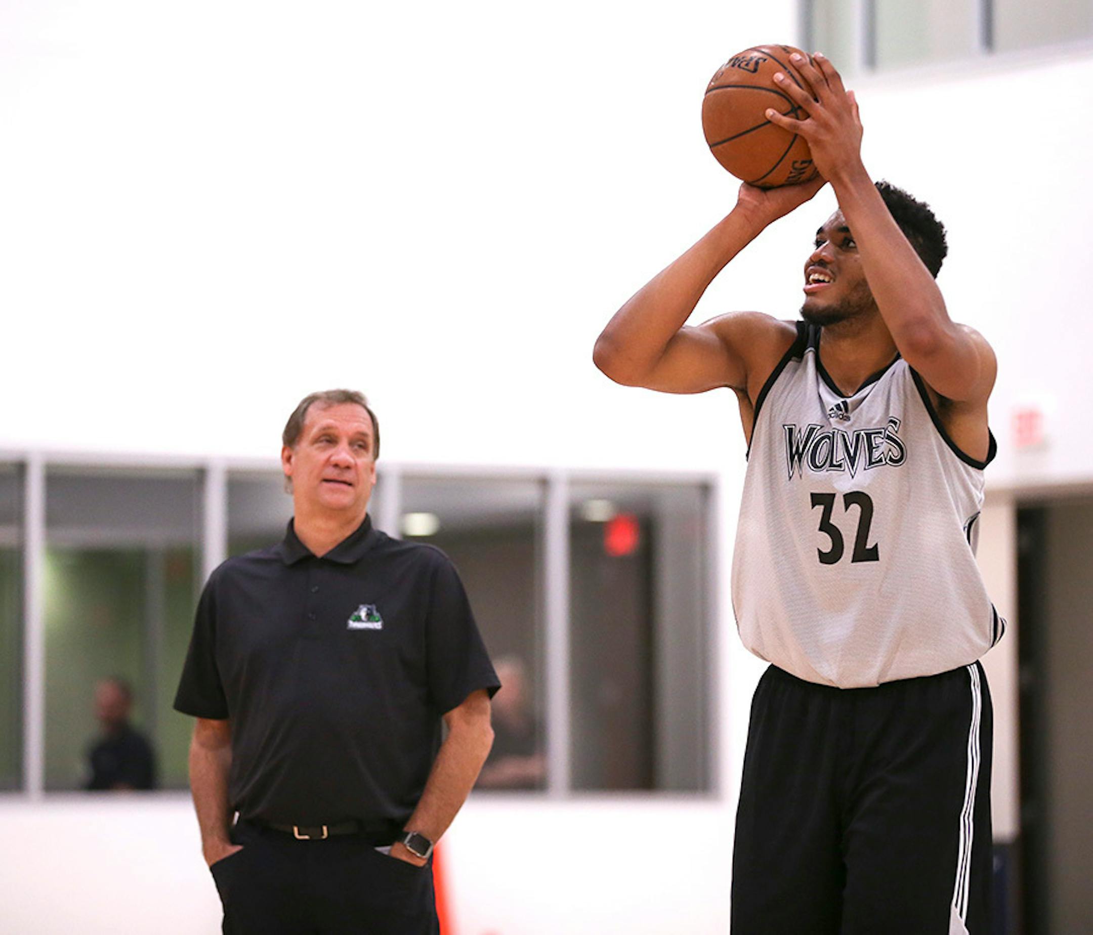 The Timberwolves' number one draft pick, Karl-Anthony Towns, shot free throws at the end of practice while visiting with head coach Flip Saunders.