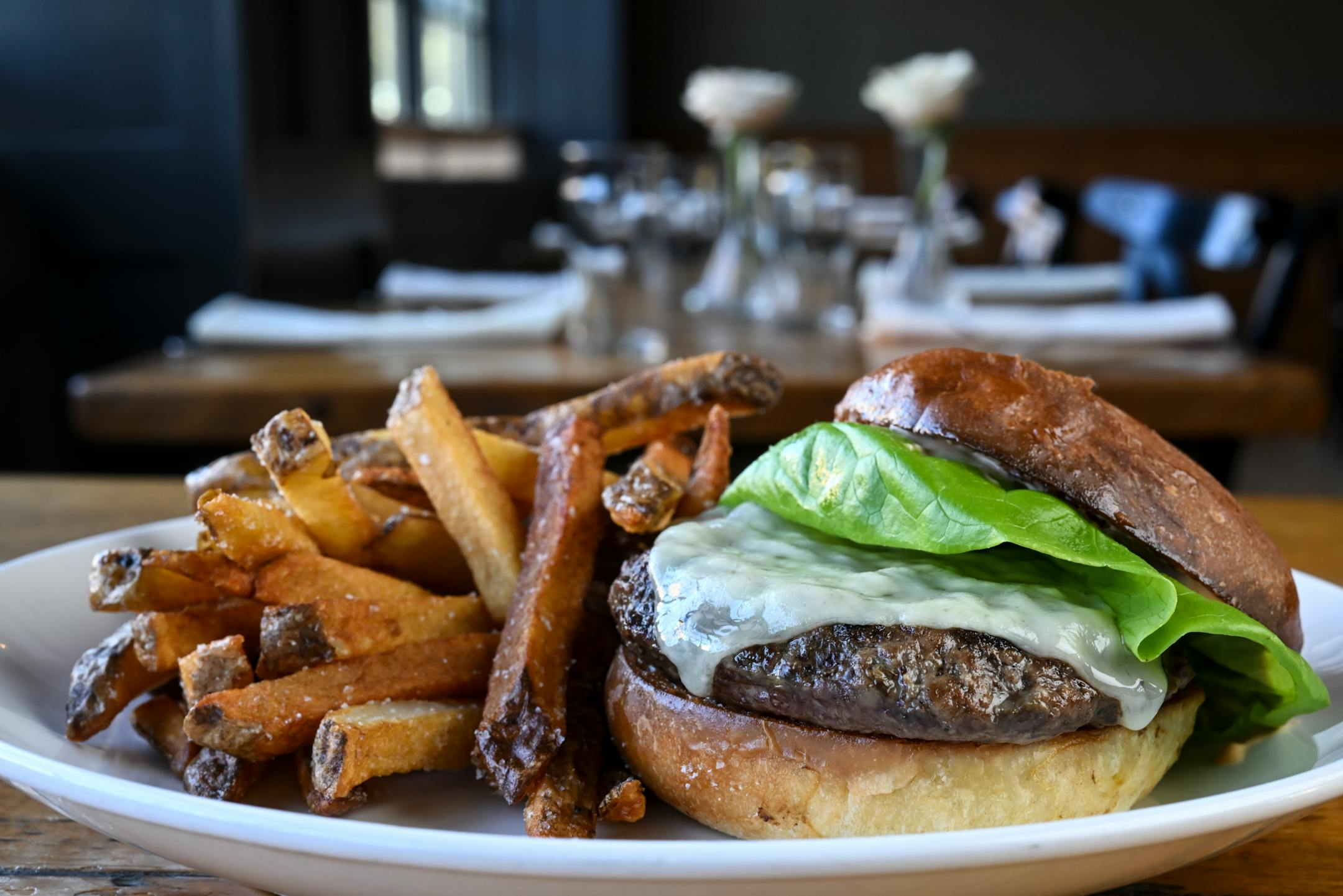 The beef burger with tomato aioli and brioche bun with french fries at The Kenwood.
