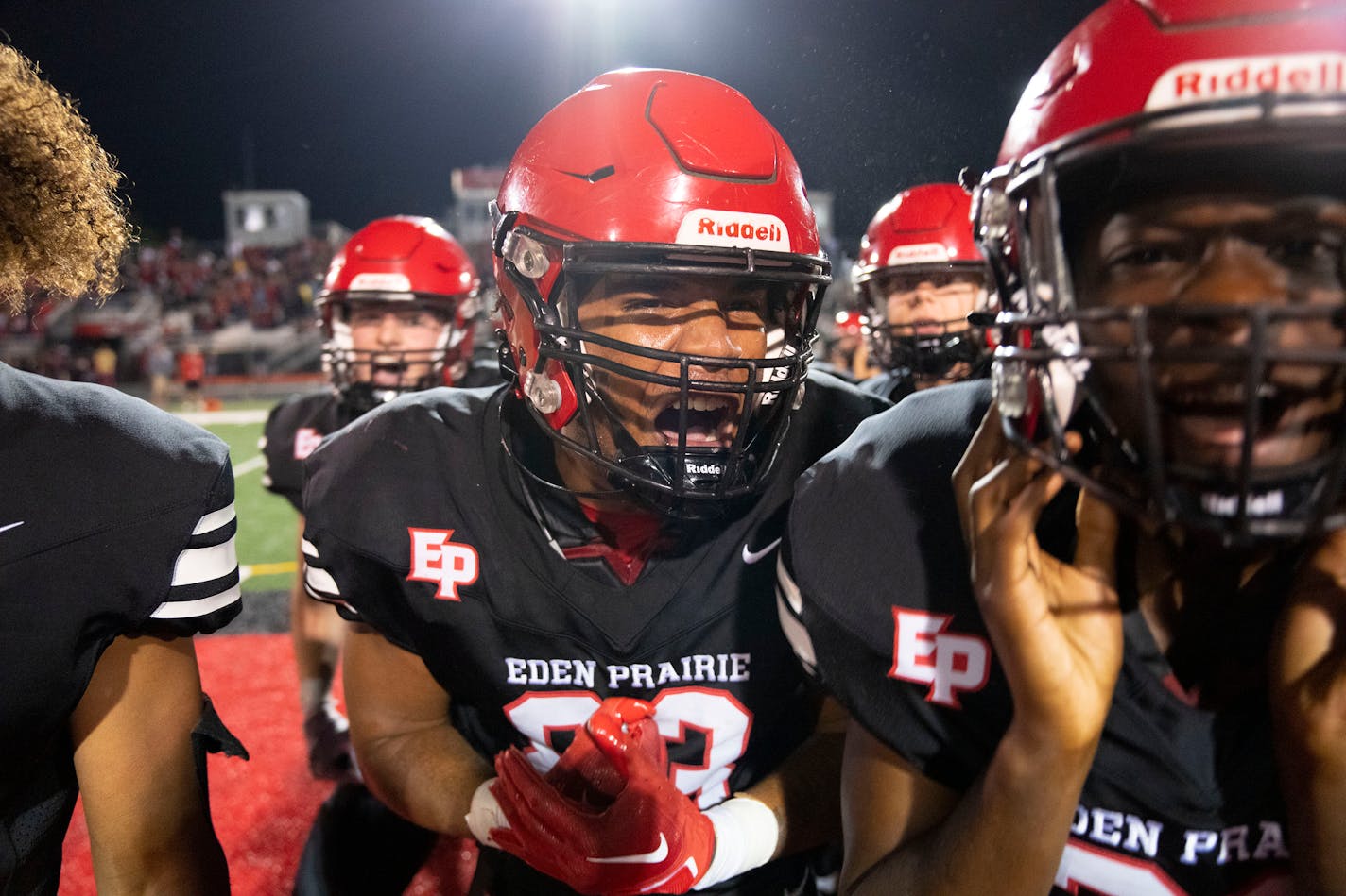 Eden Prairie tight end Jermell Taylor (83) celebrates with his teammates after they defeated top ranked Lakeville South 21-6 Friday, September 16, 2022 at Eden Prairie High School in Eden Prairie, Minn. ]