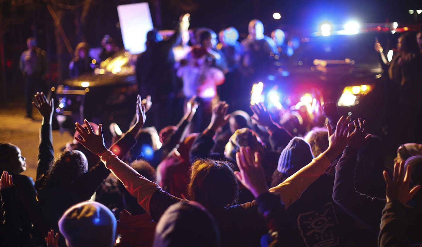 Some demonstrators sat down in the street as others chanted at Minneapolis Police Officers at the side entrance to the 4th Precinct station on Morgan Ave. N. Sunday night in Minneapolis. ] JEFF WHEELER &#xef; jeff.wheeler@startribune.com After a man was shot by Minneapolis police early Sunday morning, Black Lives Matters and others protested Sunday night at the Minneapolis Police 4th Precinct station on Plymouth Ave. N.