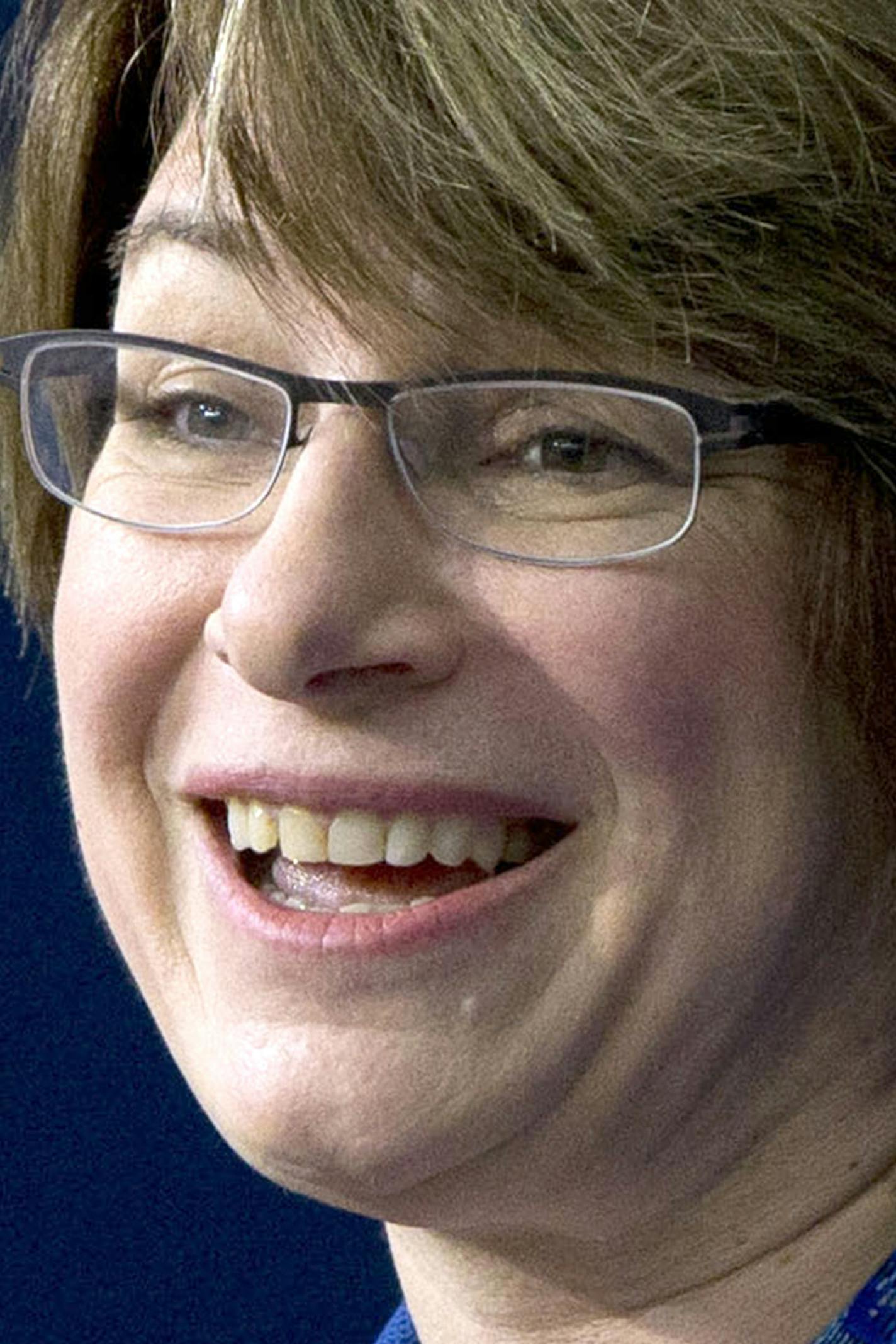 FILE - In this Feb. 18, 2015 file photo, Sen. Amy Klobuchar, D-Minn. speaks during the White House Summit on Countering Violent Extremism in Washington. Henry and Holt Company announced Thursday that Klobuchar is working on an &#xcf;inspiring, witty&#xd3; book about her life and how to set aside &#xcf;partisan flame throwing&#xd3; in politics. The book is called &#xcf;The Senator Next Door&#xd3; and is scheduled for Aug. 25. (AP Photo/Carolyn Kaster, File) ORG XMIT: MIN2015040217431559