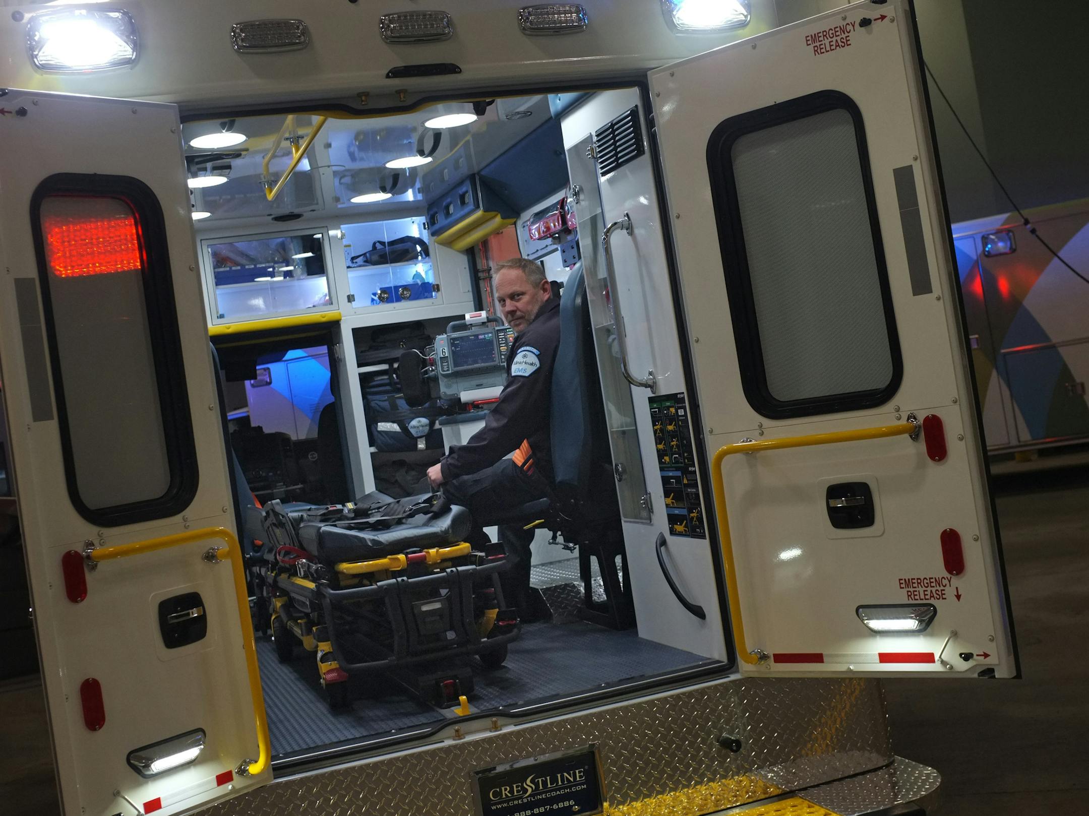 Veteran paramedic Mike Erickson showed how the new seats allow EMS personnel to be safely strapped in while the patient is still within easy reach.