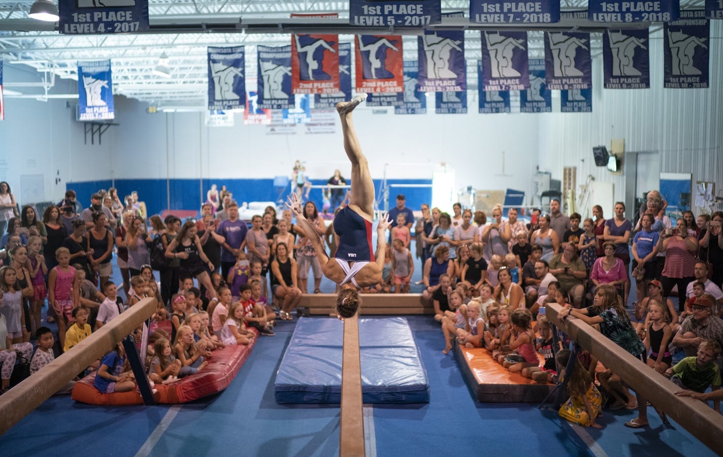 Grace McCallum warmed up on the balance beam before a crowd of young fans at Twin Cities Twisters Sunday afternoon.