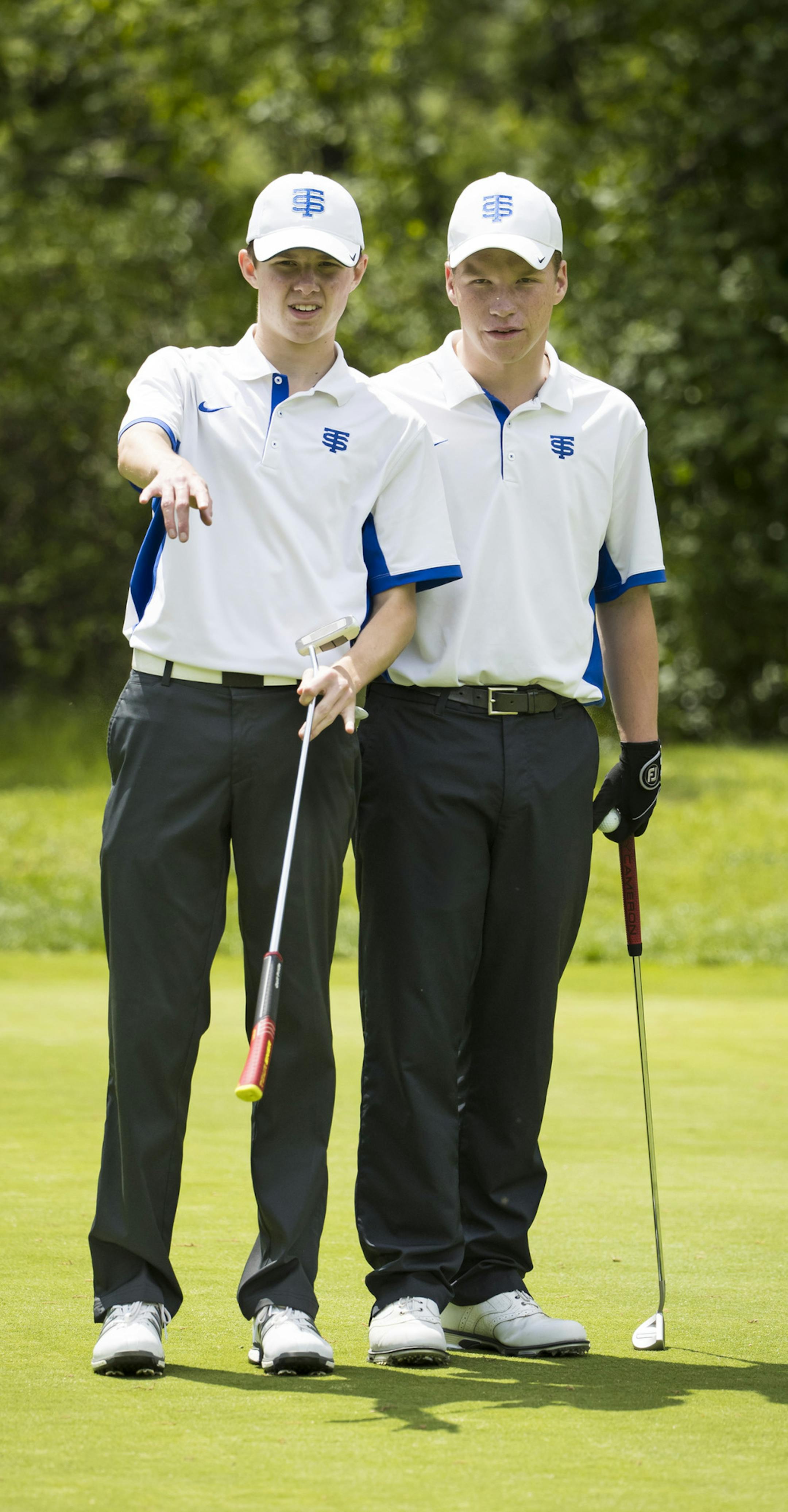 Brady Arnett and Jack Rowe discussed a putt during a Metro East Conference meet at the White Bear Yacht Club in Dellwood, Minn., on Monday, May 22, 2017. ] RENEE JONES SCHNEIDER &#x2022; renee.jones@startribune.com