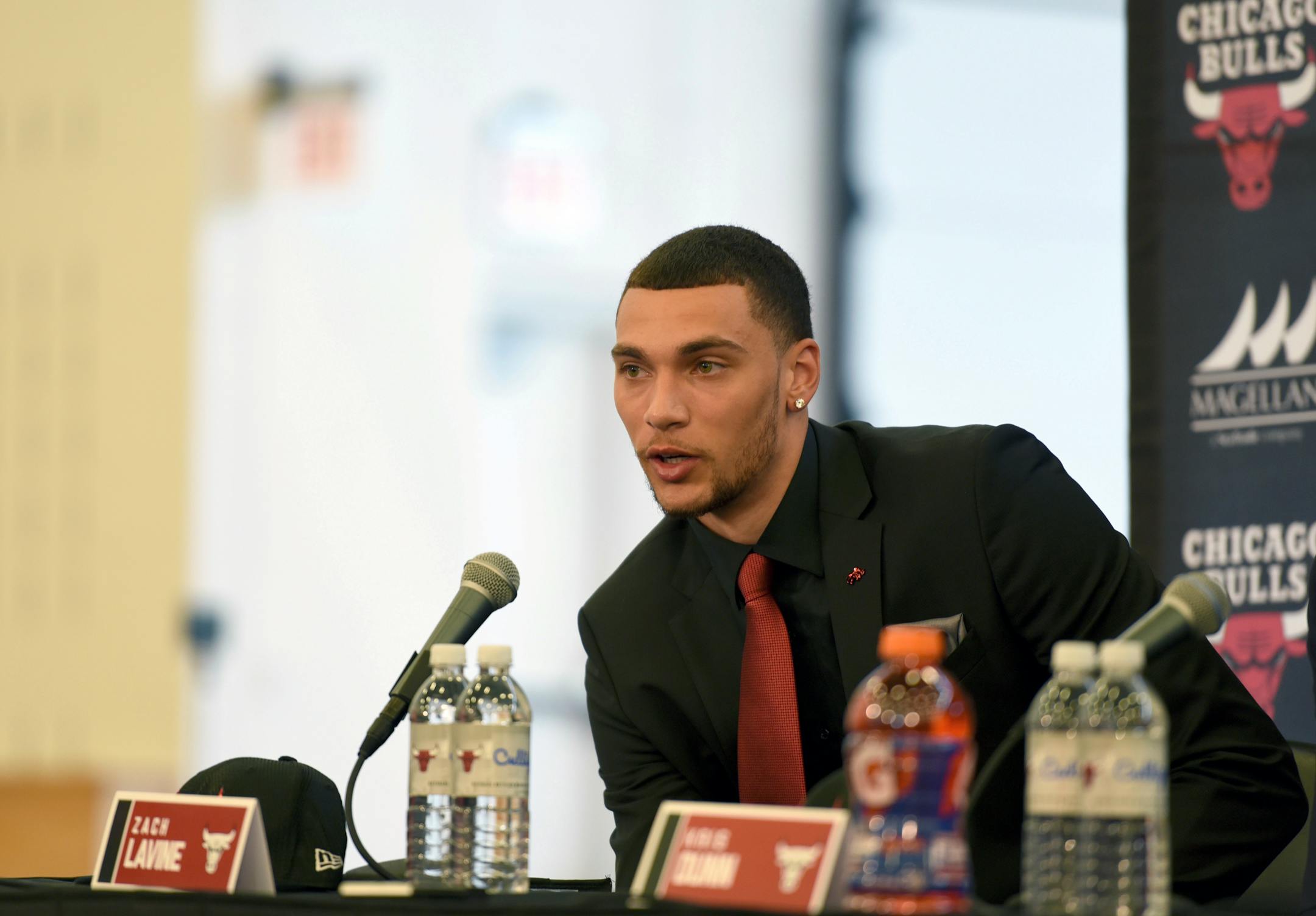 Zach Lavine answer questions during a news conference at the Chicago Bulls NBA basketball team training facility, Tuesday, June 27, 2017, in Chicago. Levine was acquired by the Bulls from the Minnesota Timberwolves. (AP Photo/G-Jun Yam)