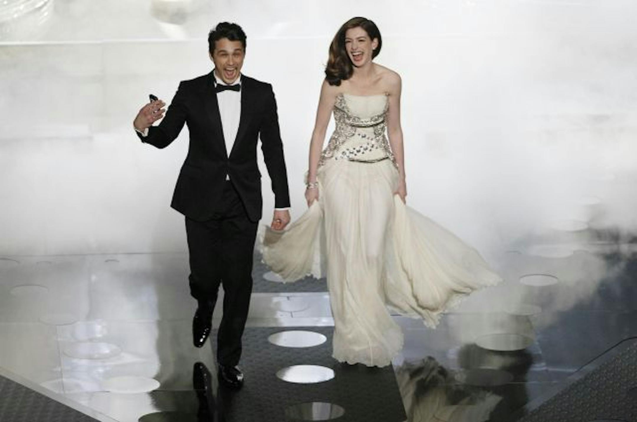 James Franco and Anne Hathaway enter the stage during the 83rd Annual Academy Awards at the Kodak Theatre in Los Angeles, California, on Sunday, February 27, 2011.