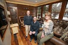 Carl Unger, left, and Nate Tollefson of Craft Design Build with homeowner Caryn Schall in the new year-round room they created in a former three-seaso