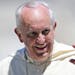 Pope Francis blesses faithful as he leaves St. Peter's Square at the end of the weekly general audience, at the Vatican, Wednesday, May 14, 2014. (AP 