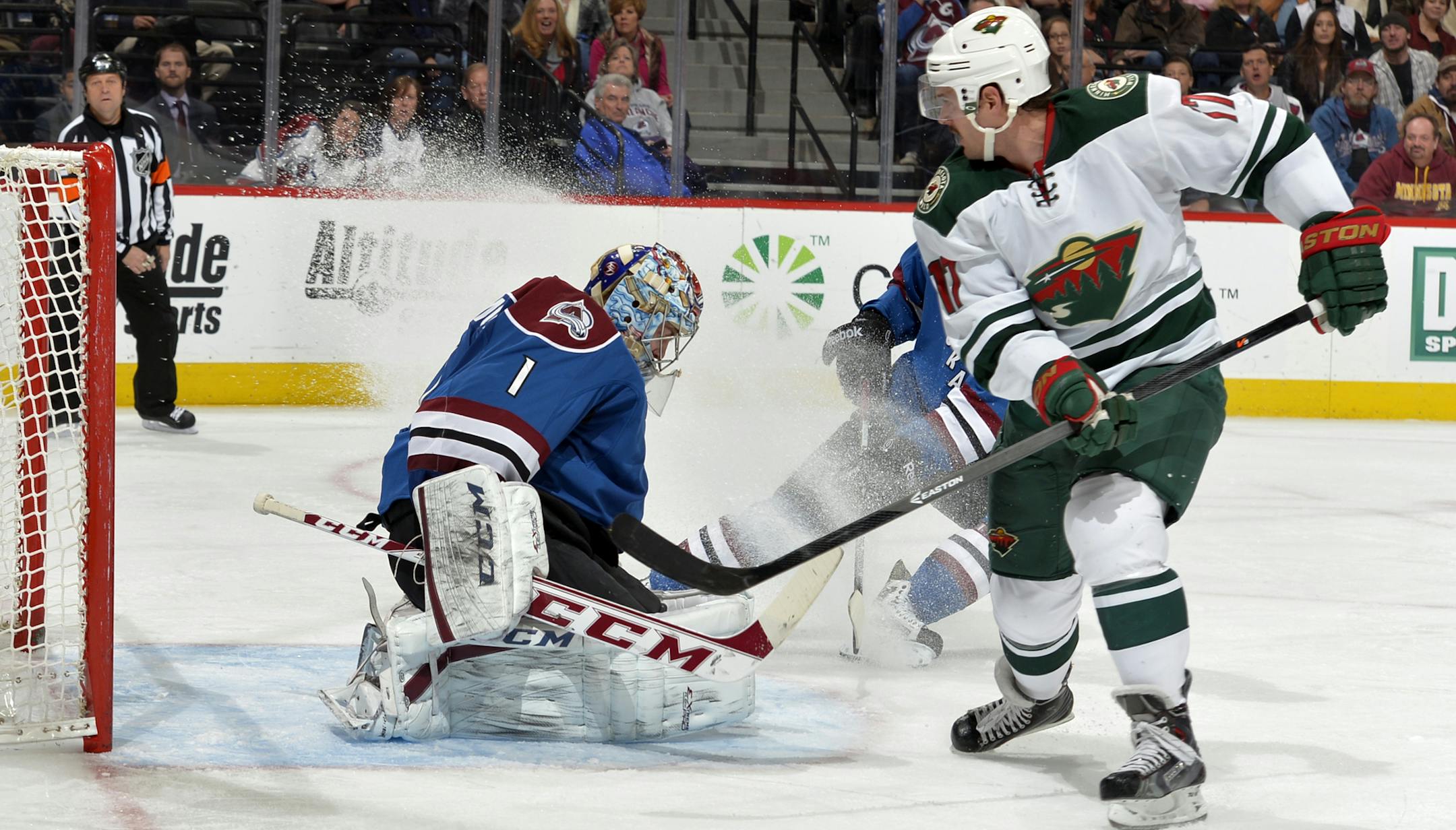 Colorado Avalanche goalie Semyon Varlamov (1) from Russia blocks a shot by Minnesota Wild center Torrey Mitchell (17) during the second period of an NHL hockey game Saturday, Nov. 30, 2013, in Denver. (AP Photo/Jack Dempsey)