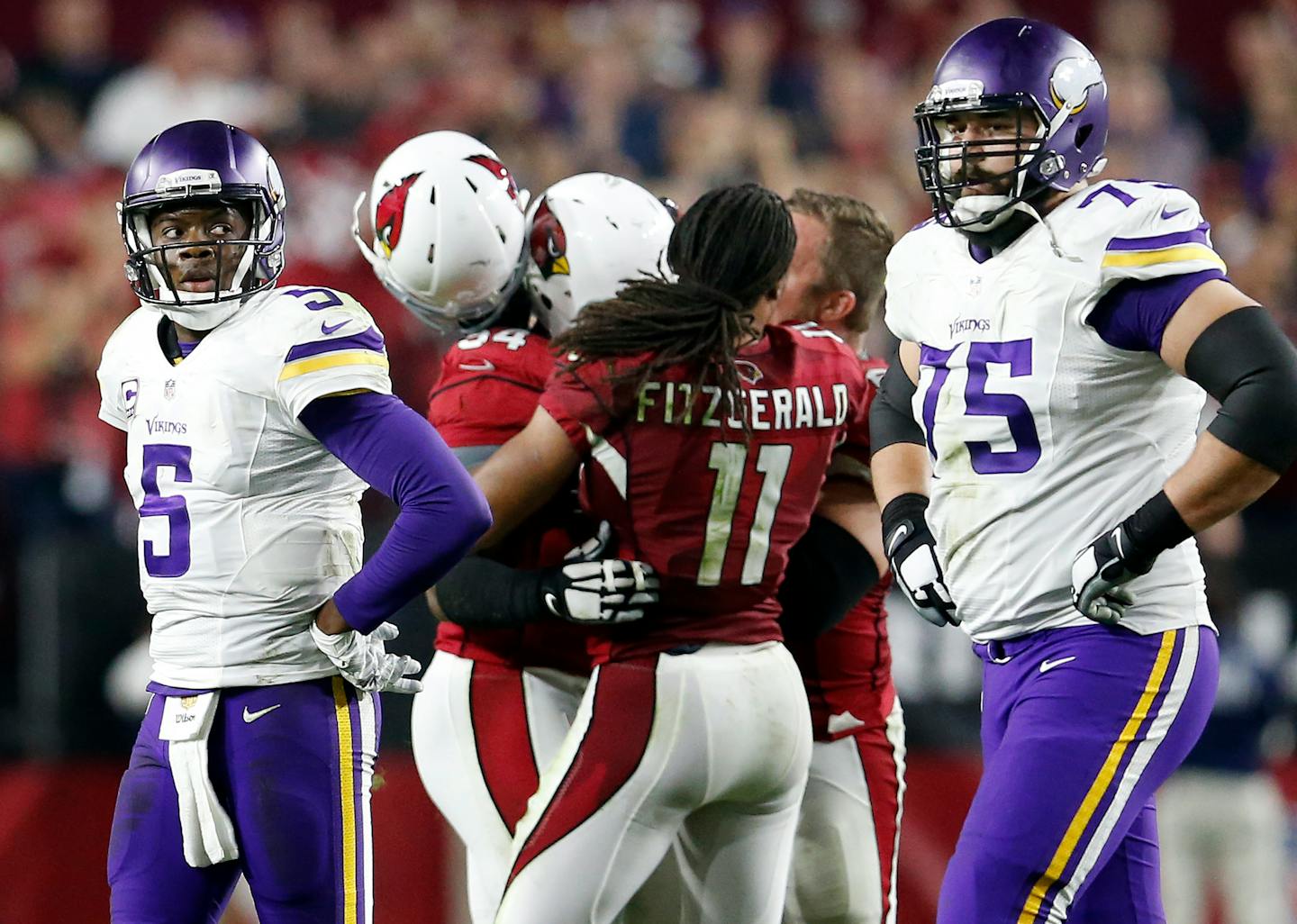 Vikings quarterback Teddy Bridgewater (5) and Matt Kalil (75) walked off the field as the Cardinals celebrated after recovering a Bridgewater fumble in the final seconds of the game. ] CARLOS GONZALEZ � cgonzalez@startribune.com - December 10, 2015, Glendale, AZ, University of Phoenix Stadium, NFL, Minnesota Vikings vs. Arizona Cardinals