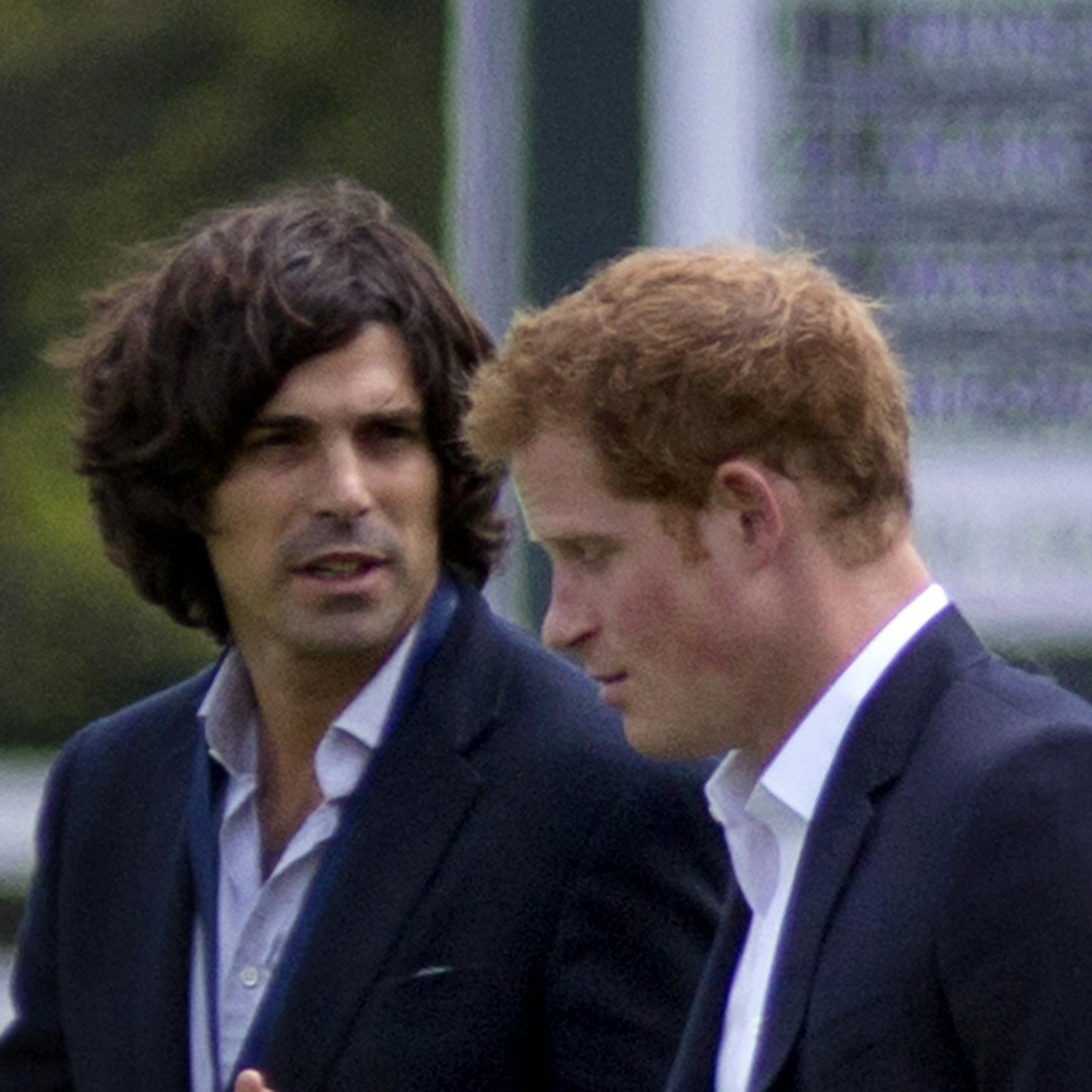 Britain's Prince Harry, right, walks with polo player Nacho Figueras before the Sentebale Royal Salute Polo Cup charity match in Greenwich, Conn., Wednesday, 15, 2103. (AP Photo/Craig Ruttle)
