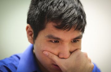 Chess Grandmaster Wesley So concentrated as he played chess with Sean Nagle at the Ridgedale Public Library on Friday, February 27, 2015 in Minnetonka