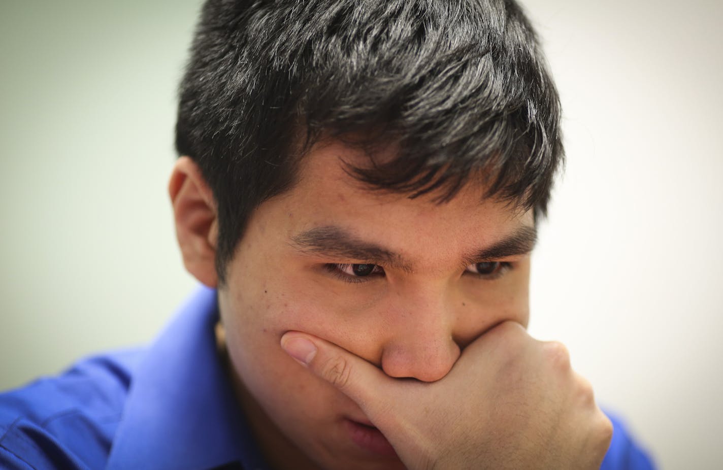 Chess Grandmaster Wesley So concentrated as he played chess with Sean Nagle at the Ridgedale Public Library on Friday, February 27, 2015 in Minnetonka.