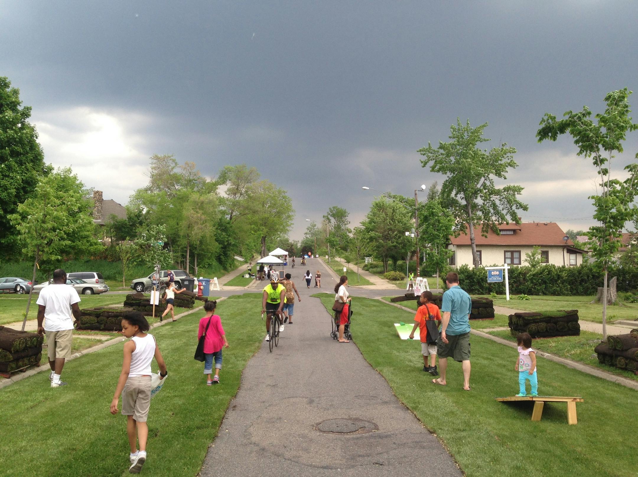 Residents look at what a proposed bike route through N Mpls could look like. The streets have been sodded.