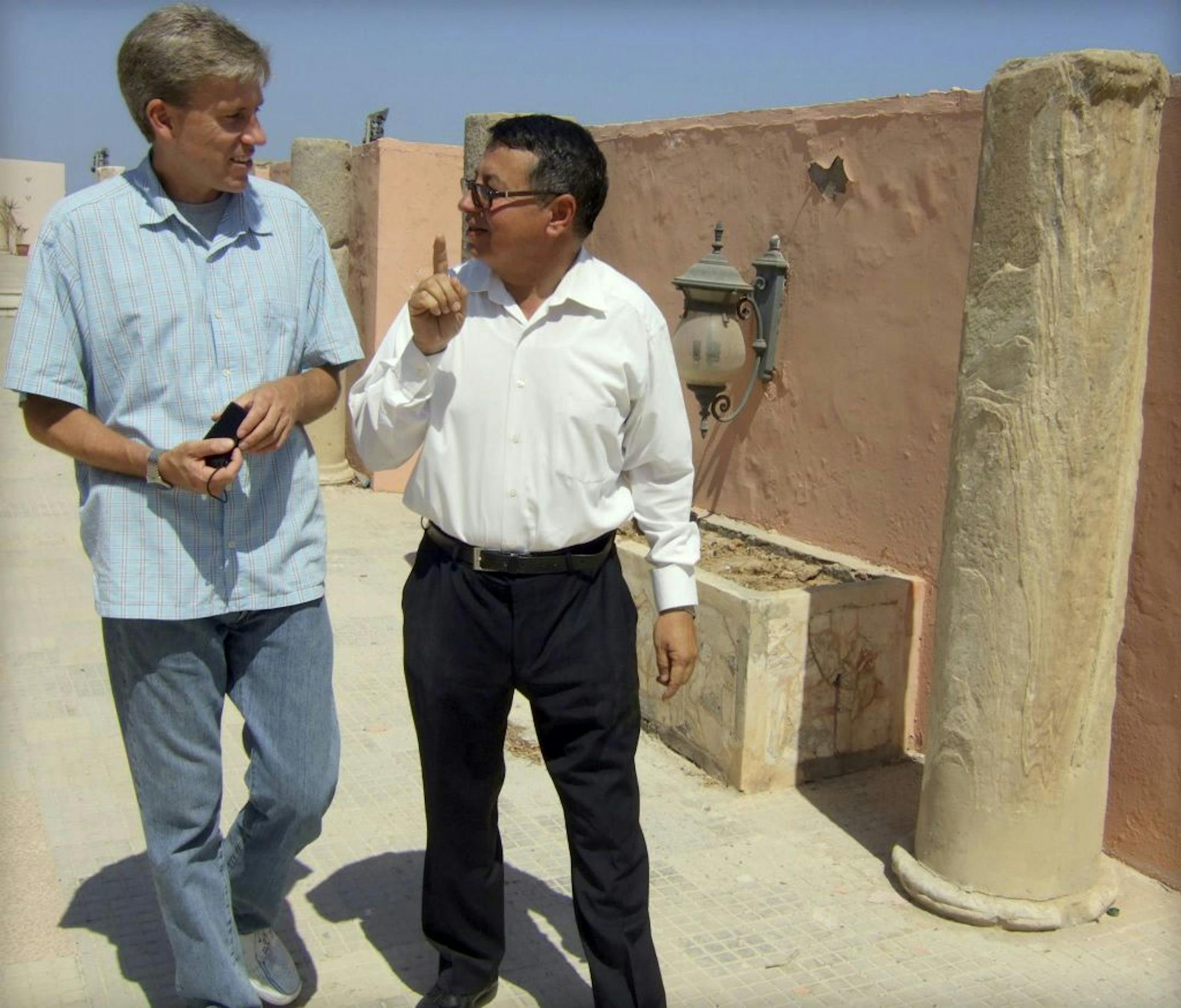 Ambassador Christopher Stevens, left, spoke with a translator during a tour in Tripoli, according to an August Facebook post.